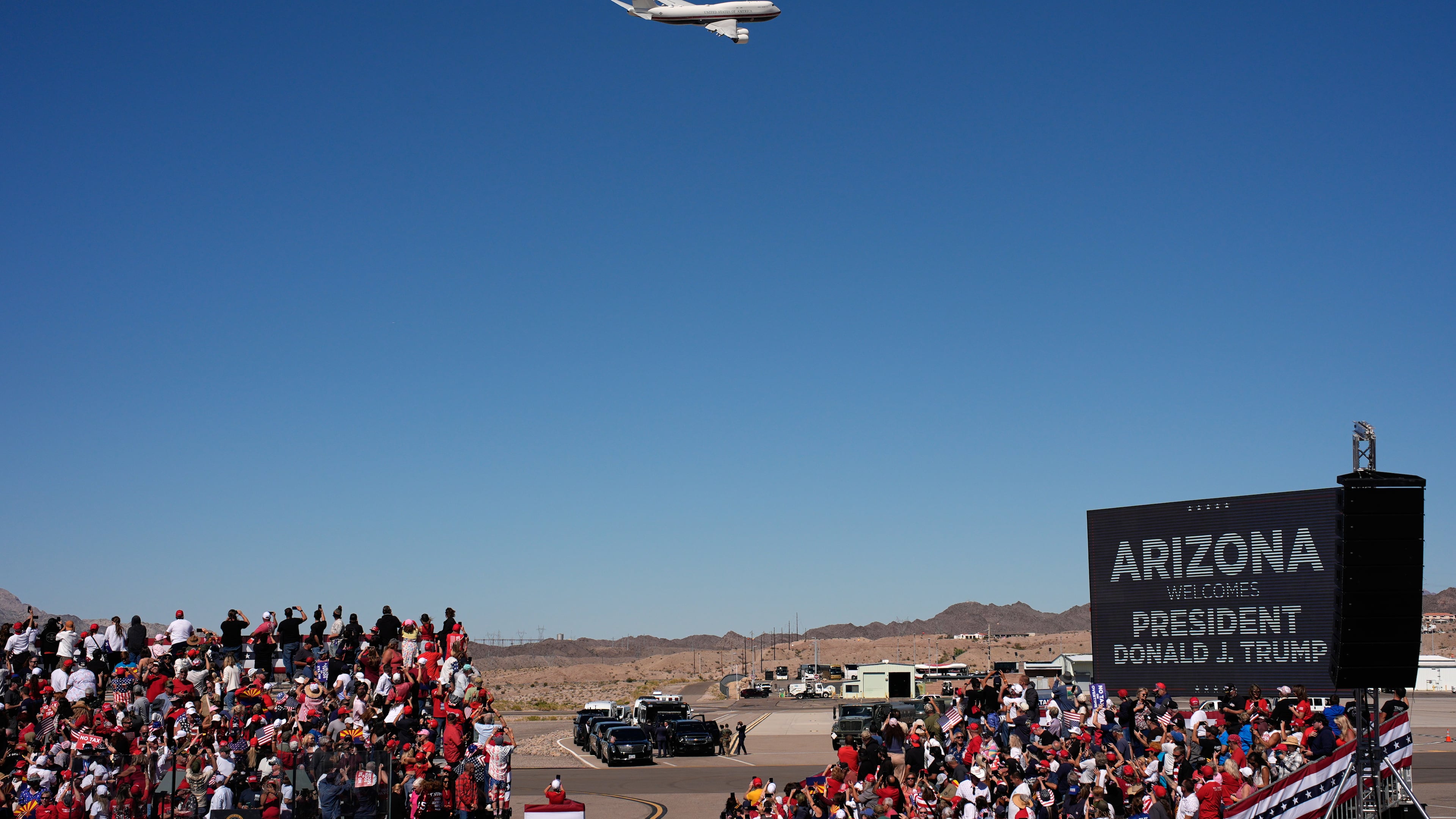 Air Force One with President Donald Trump aboard flys past before landing for a campaign rally at the Laughlin Bullhead International Airport, Wednesday, Oct. 14, 2026, in Bullhead City, Ariz. (AP Photo/John Locher)