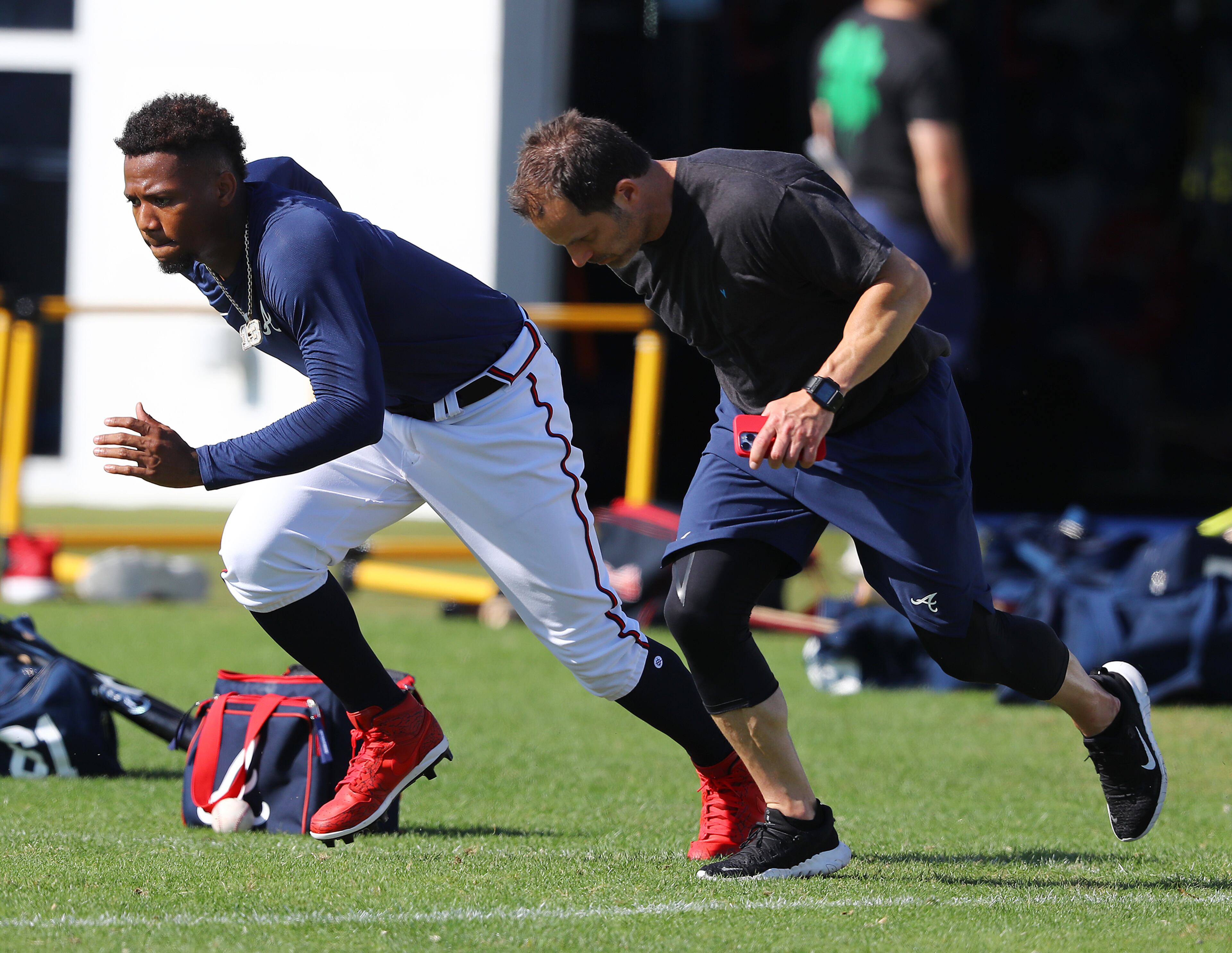 Braves outfielder Ronald Acuna runs sprints with a trainer during Spring Training on Thursday, March 17, 2022, in North Port. “Curtis Compton / Curtis.Compton@ajc.com”