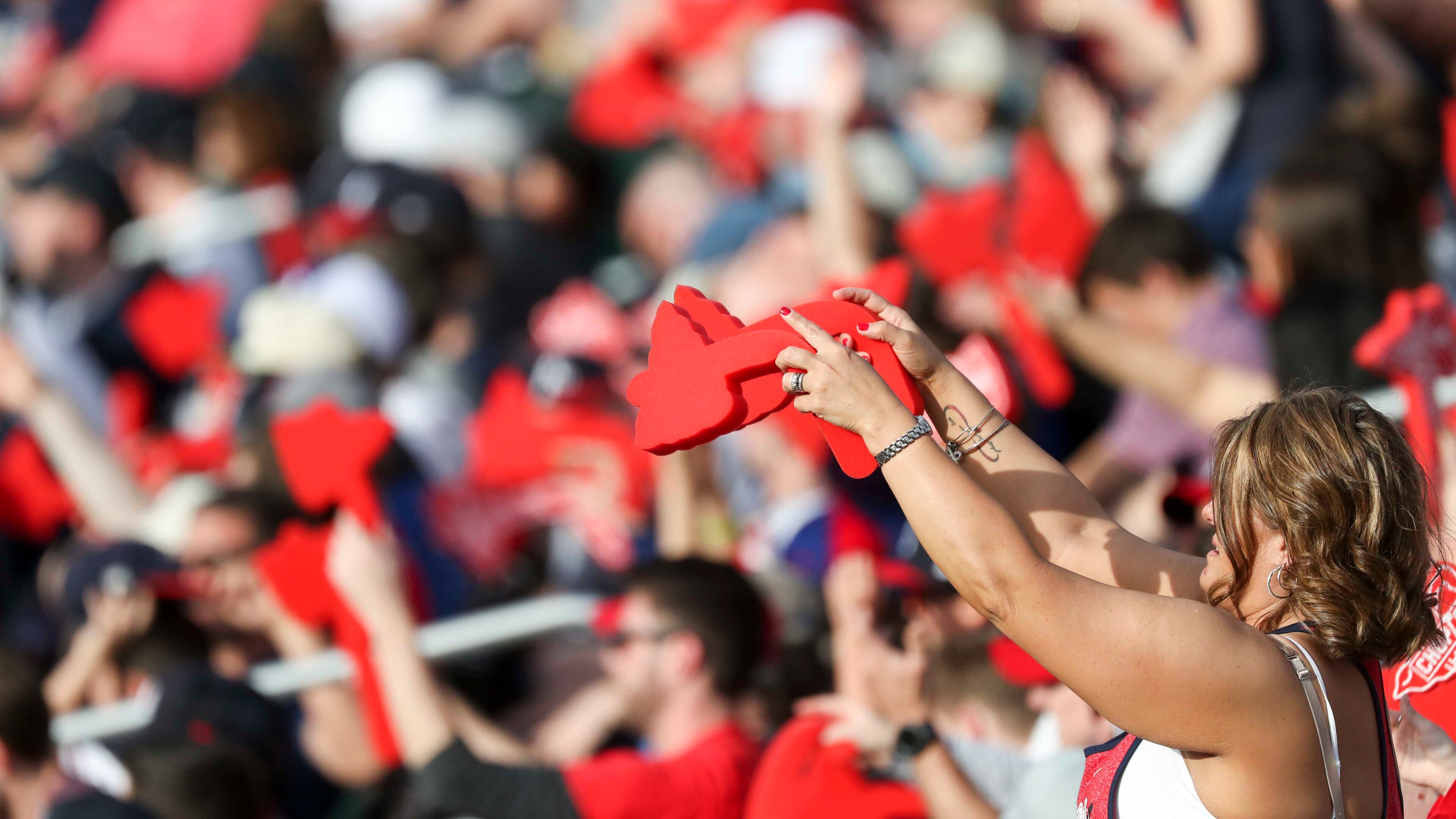 Braves fans swing their foam tomahawks during the season opener game against the Philadelphia Phillies Thursday, March 29, 2019, at SunTrust Park in Atlanta.