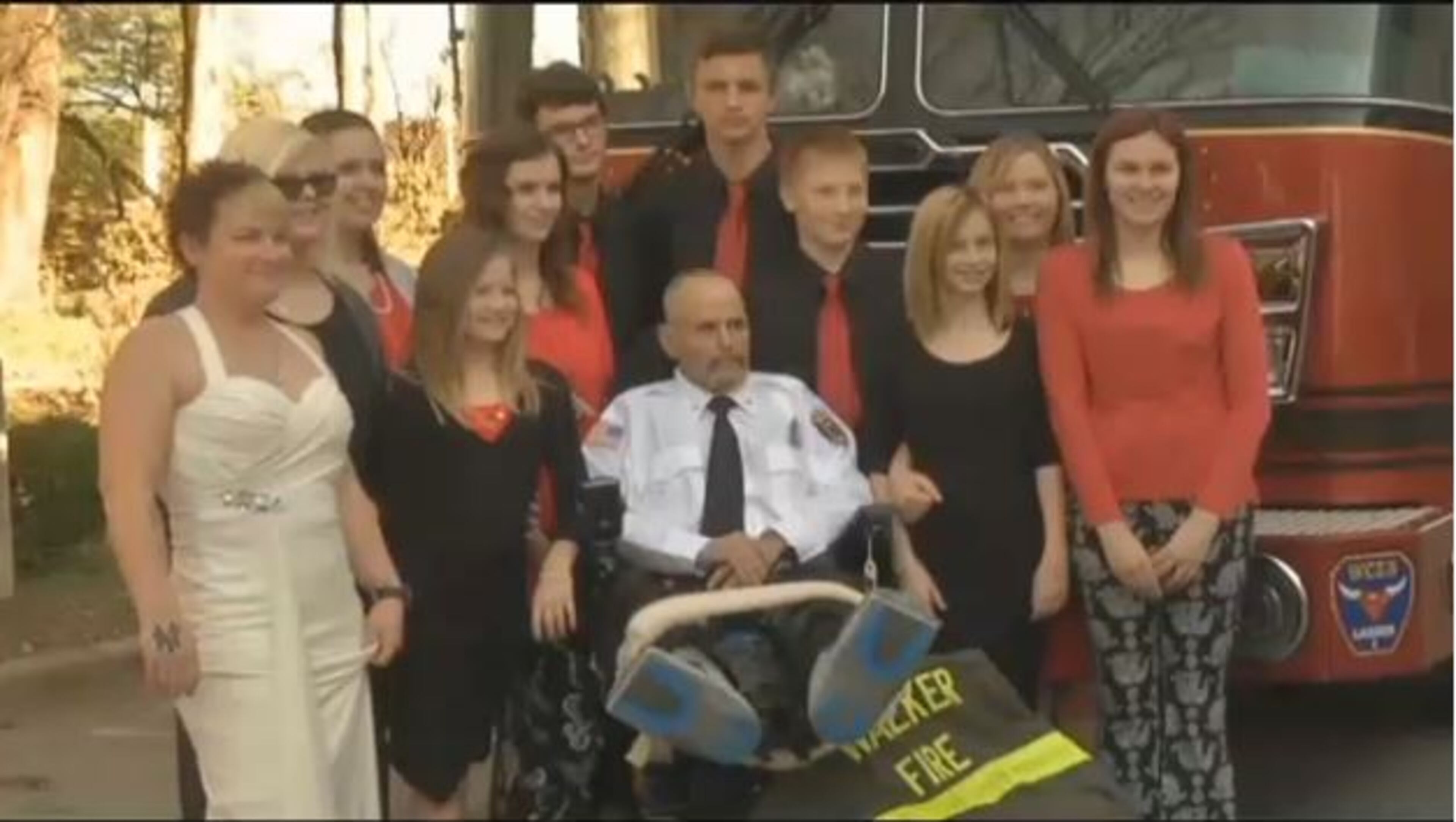 Fire Chief Matthew Mann and wife Jessica Strange pose with family members after their wedding. (Credit: WRCB-TV)