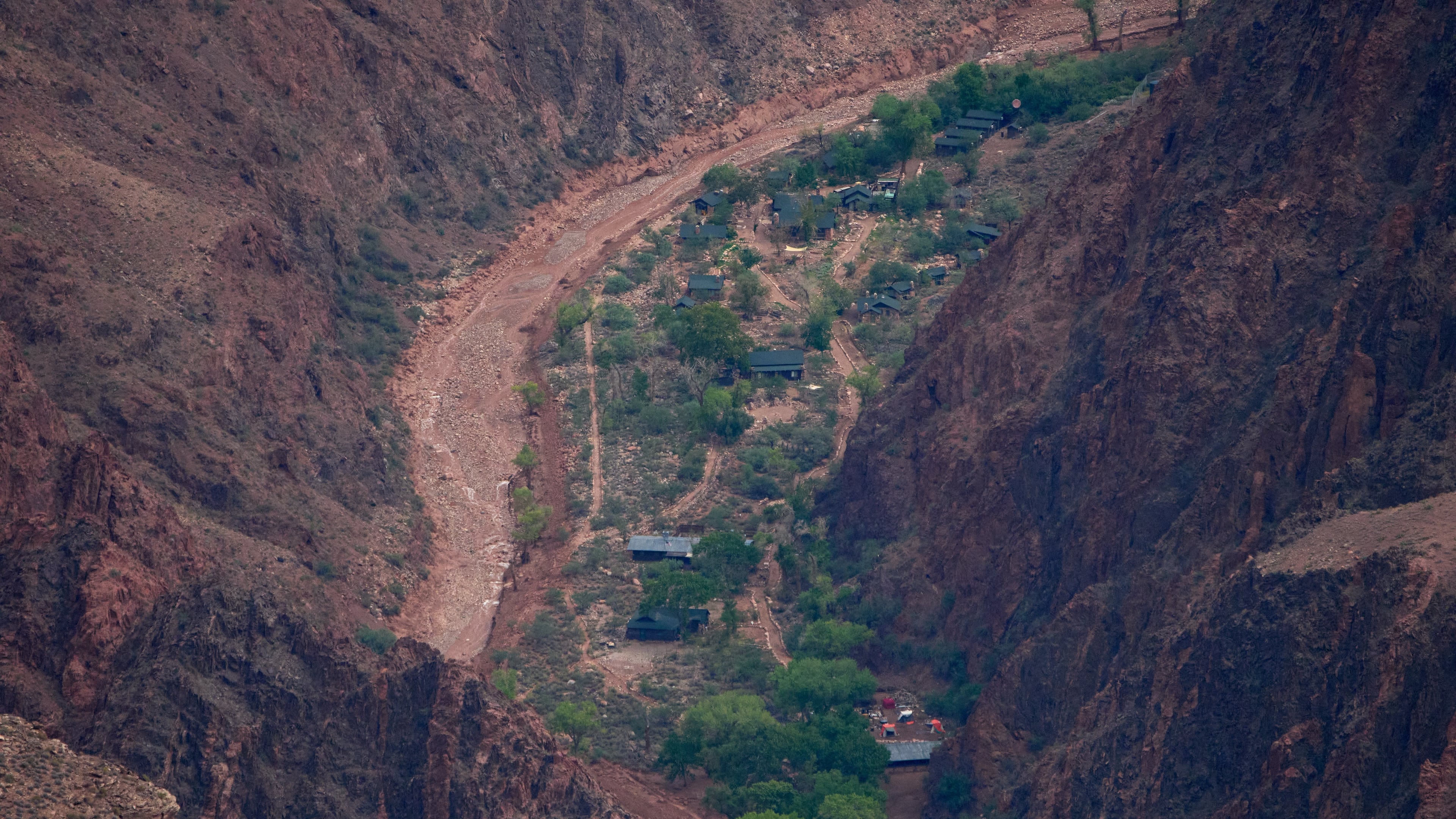 Buildings are seen in a flood damaged Bright Angel Canyon the Grand Canyon, Monday, Aug. 31, 2026, in Grand Canyon National Park, Ariz. (AP Photo/John Locher)