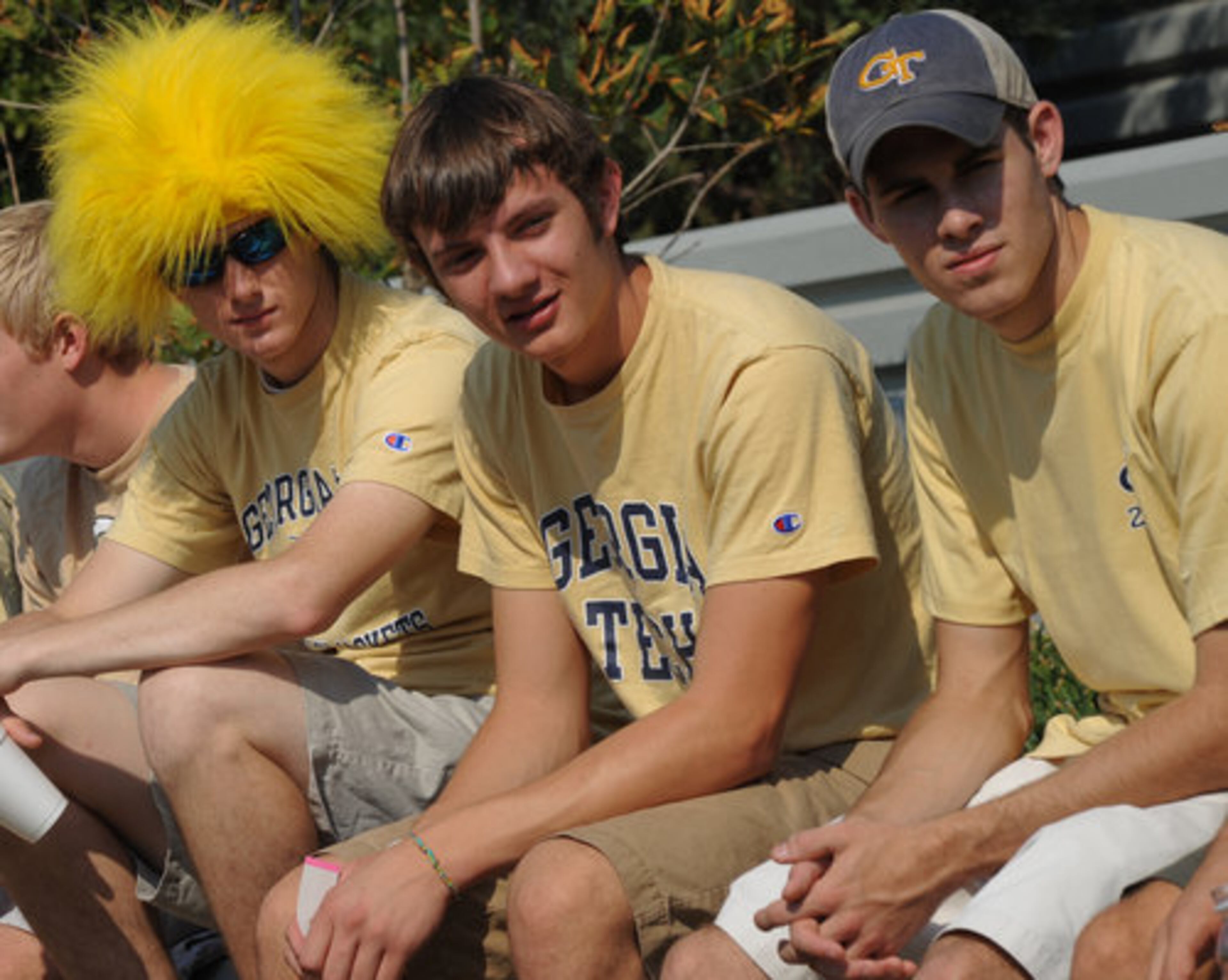 Big hair is back: Tech students Casey Simonetta (from left), Michael Ring and Matt Sirmans watch the beanbag toss.