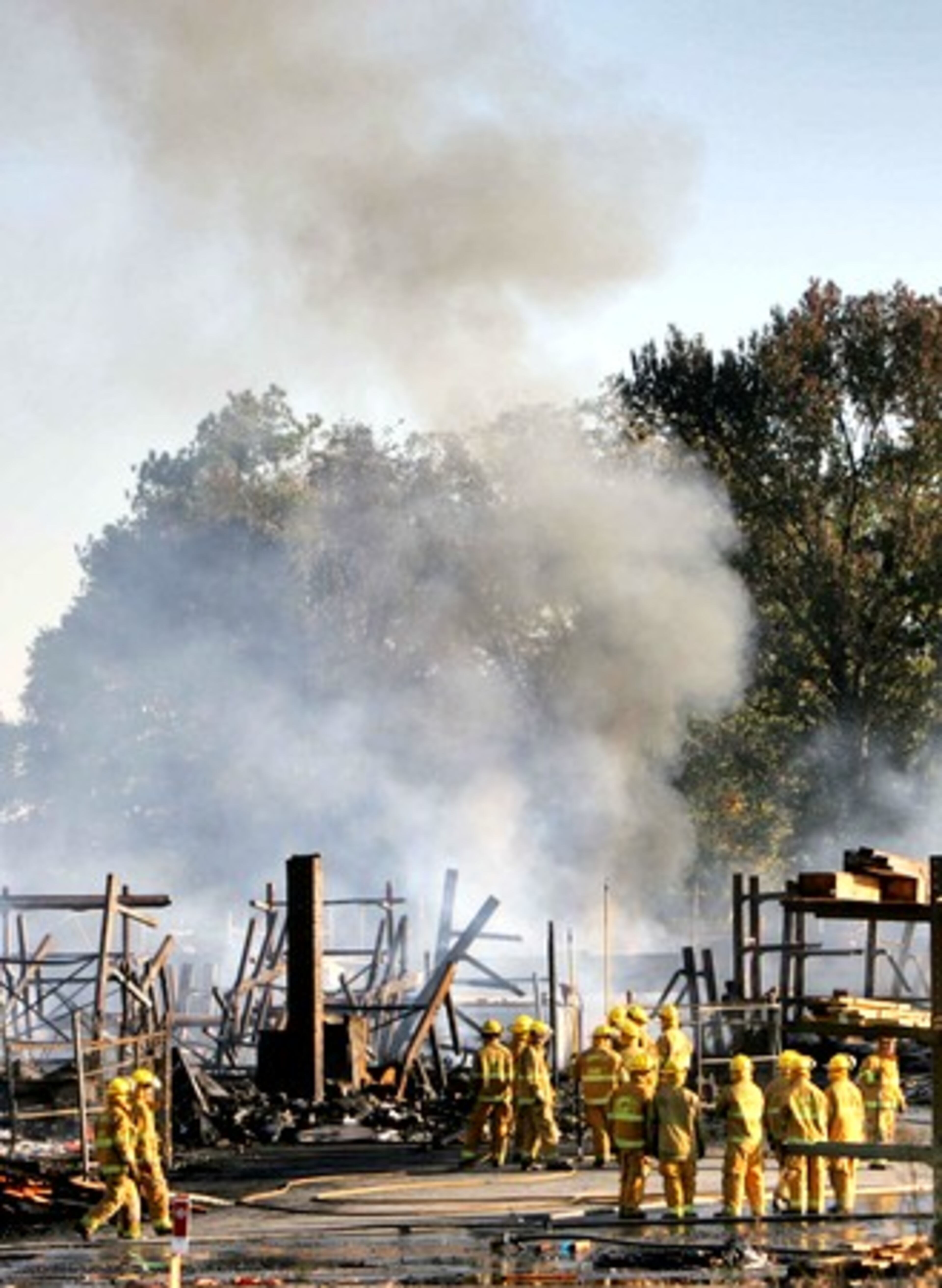 Gwinnett County firefighters continued to pour water on hot spots more than 12 hours after the fire broke out.