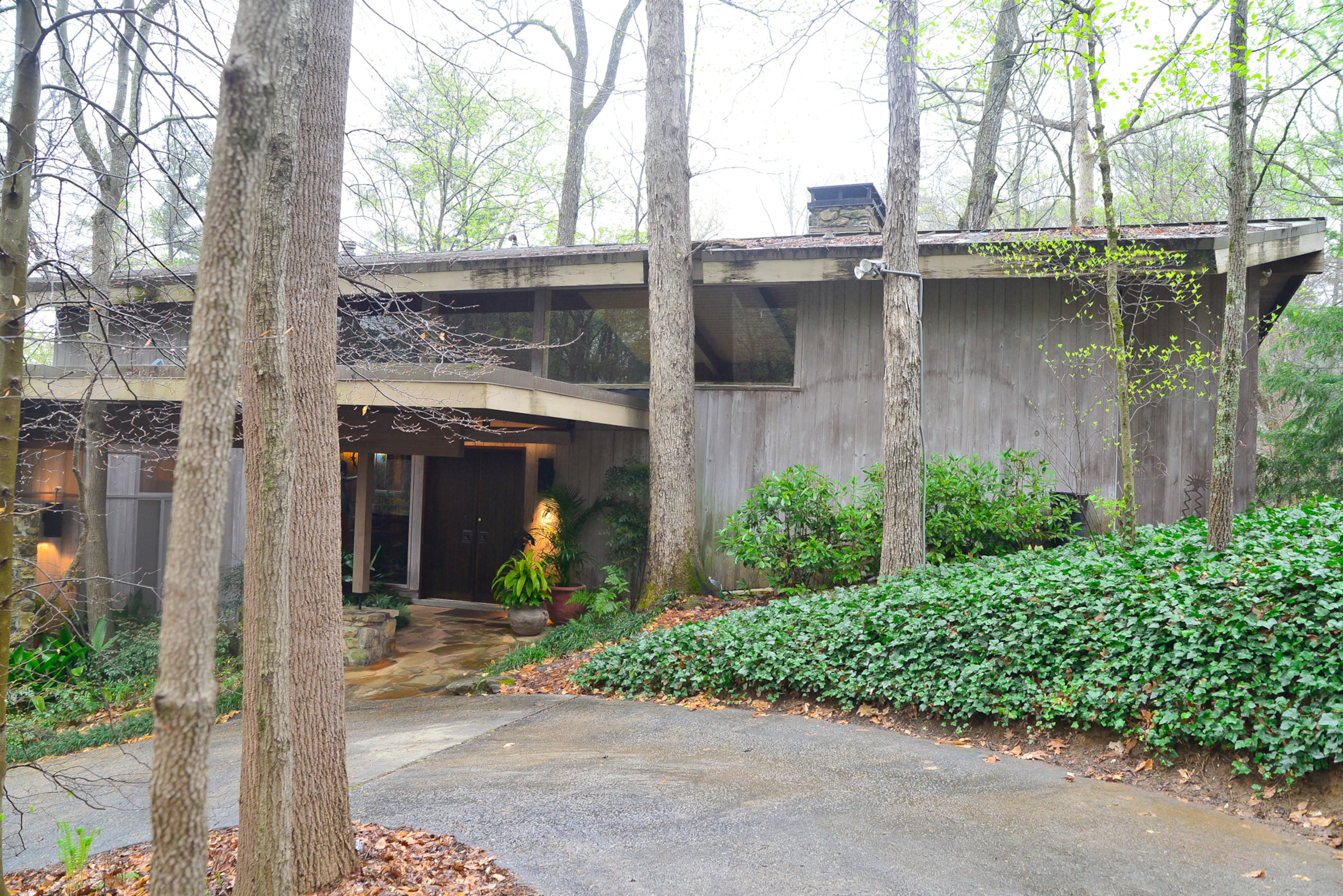 The mid-century modern home was inspired by Frank Lloyd Wright's architecture. The home was designed by the late architect Herb Milkey, who integrated the architecture with the landscape.