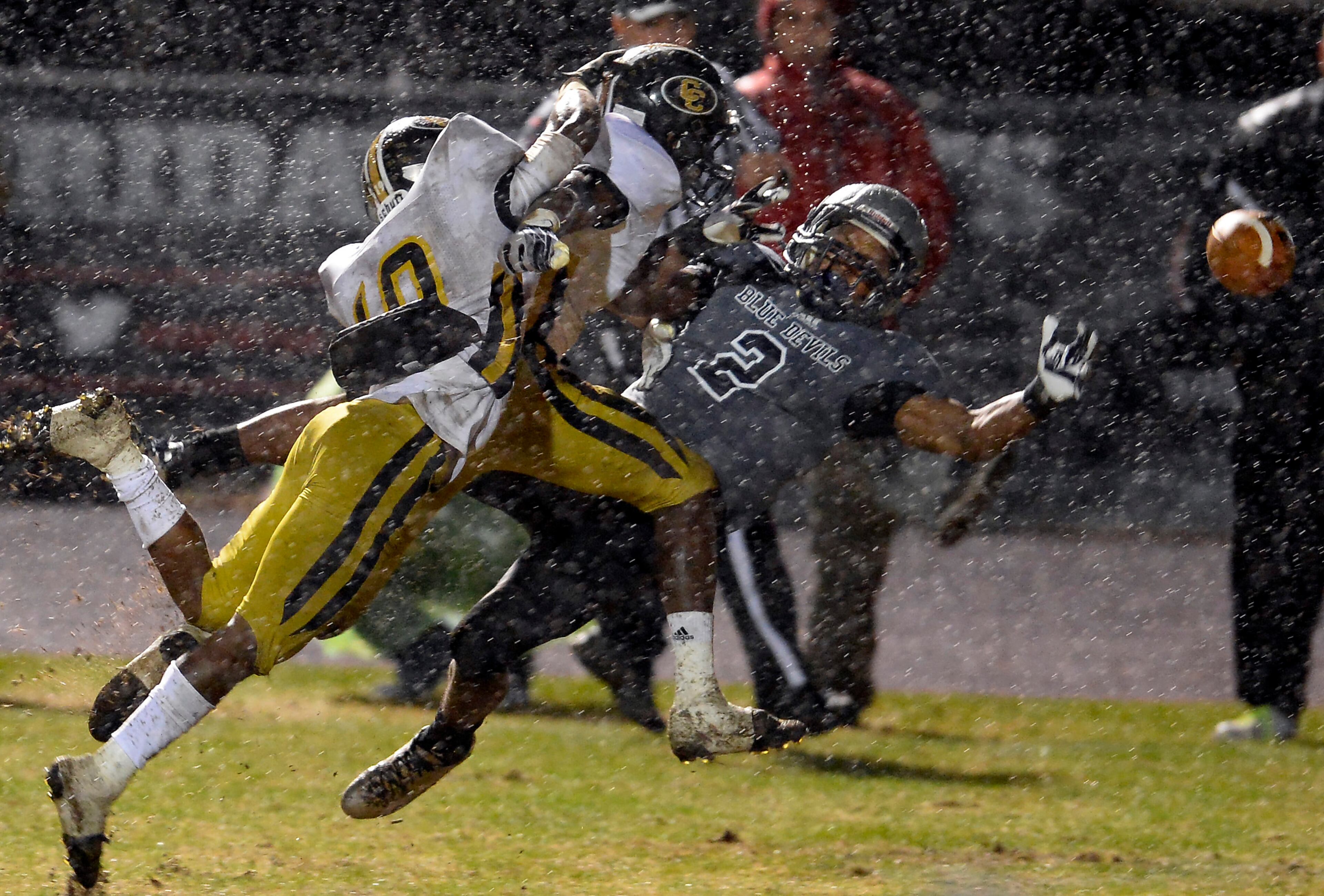 Norcross receiver Clinton Lynch (2) can't make the catch under pressure from Colquitt's Maleek Lews (19) and Quan Patillo in the second half of their AAAAAA semifinal game at Blue Devil Stadium on Friday, Dec. 6, 2013, in Norcross, Ga. Colquitt County was penalized for pass interference on the play.