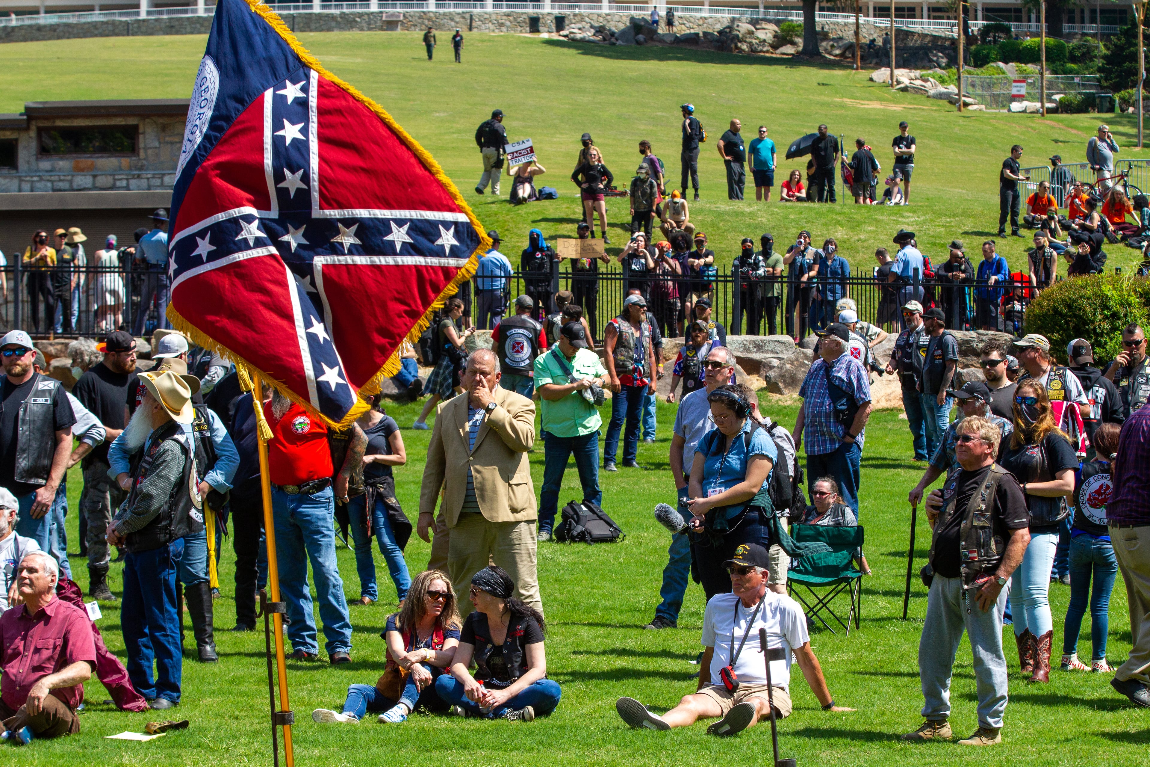 The Sons of Confederate Veterans and counterprotesters are separated by a fence during a rally at Stone Mountain Park on Saturday, April 30, 2022. (Photo: Steve Schaefer / steve.schaefer@ajc.com)