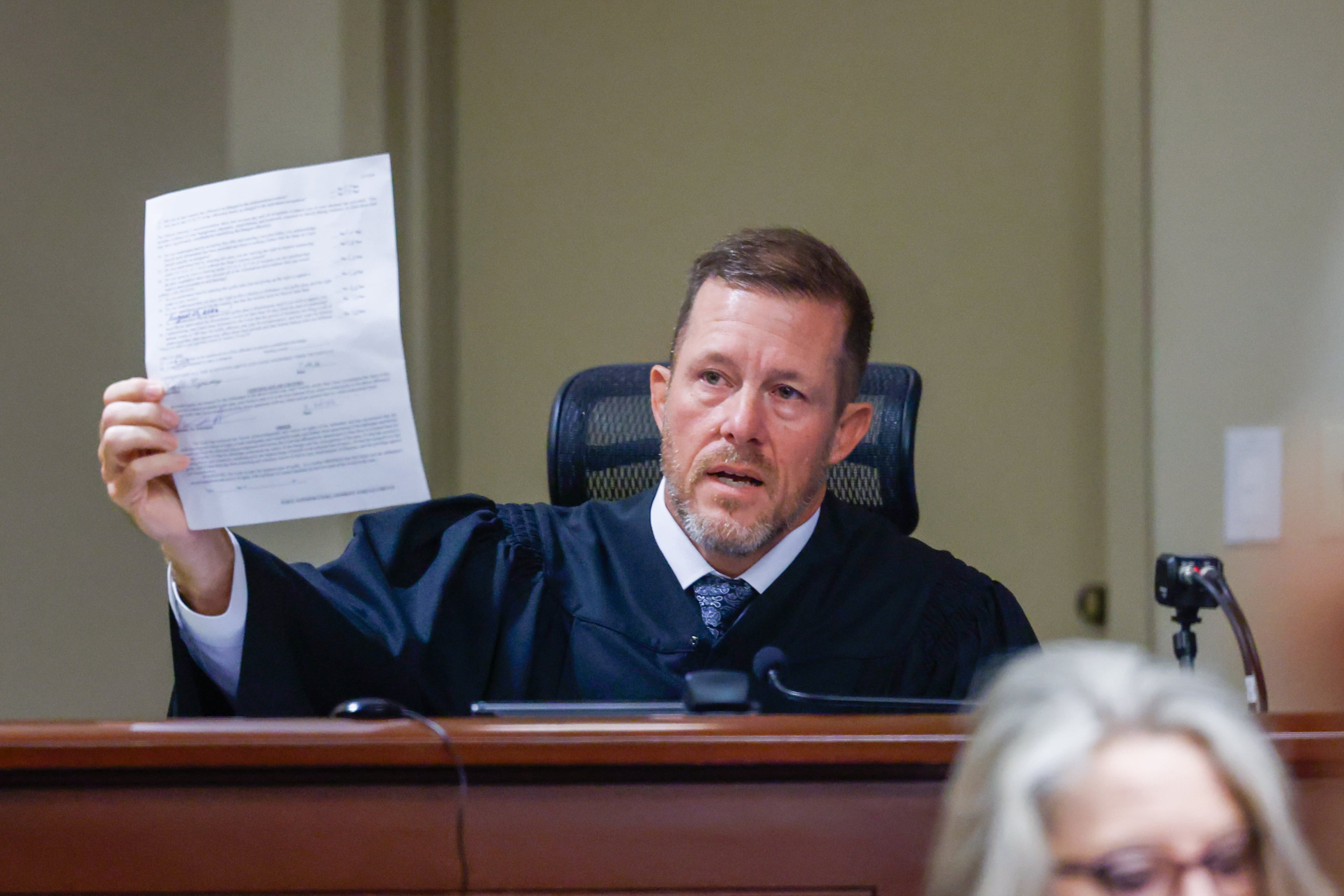 Judge Nicholas Primm holds a plea document for Colt Gray, the 16-year-old Apalachee High School shooting suspect, at Barrow County Superior Court on Friday, July 24, 2026, in Winder. (Arvin Temkar/AJC)