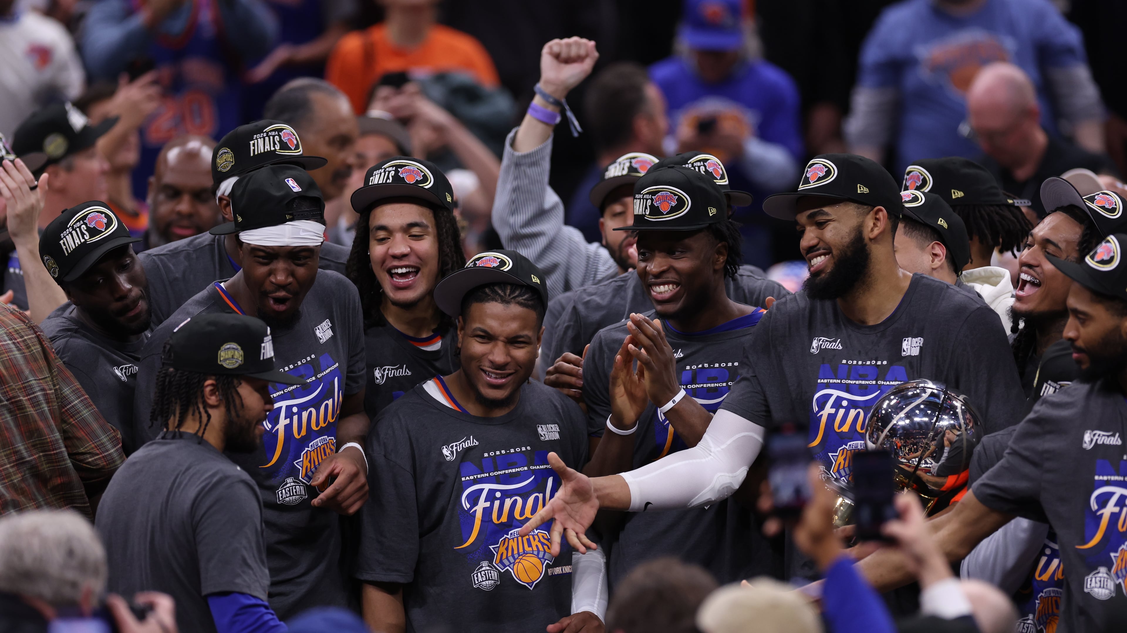 New York Knicks players celebrate with guard Jalen Brunson, left, after he was awarded with the MVP trophy after winning Game 4 in the Eastern Conference finals NBA basketball playoffs series against the Cleveland Cavaliers in Cleveland, Monday, May 25, 2026. (AP Photo/Tim Phillis)