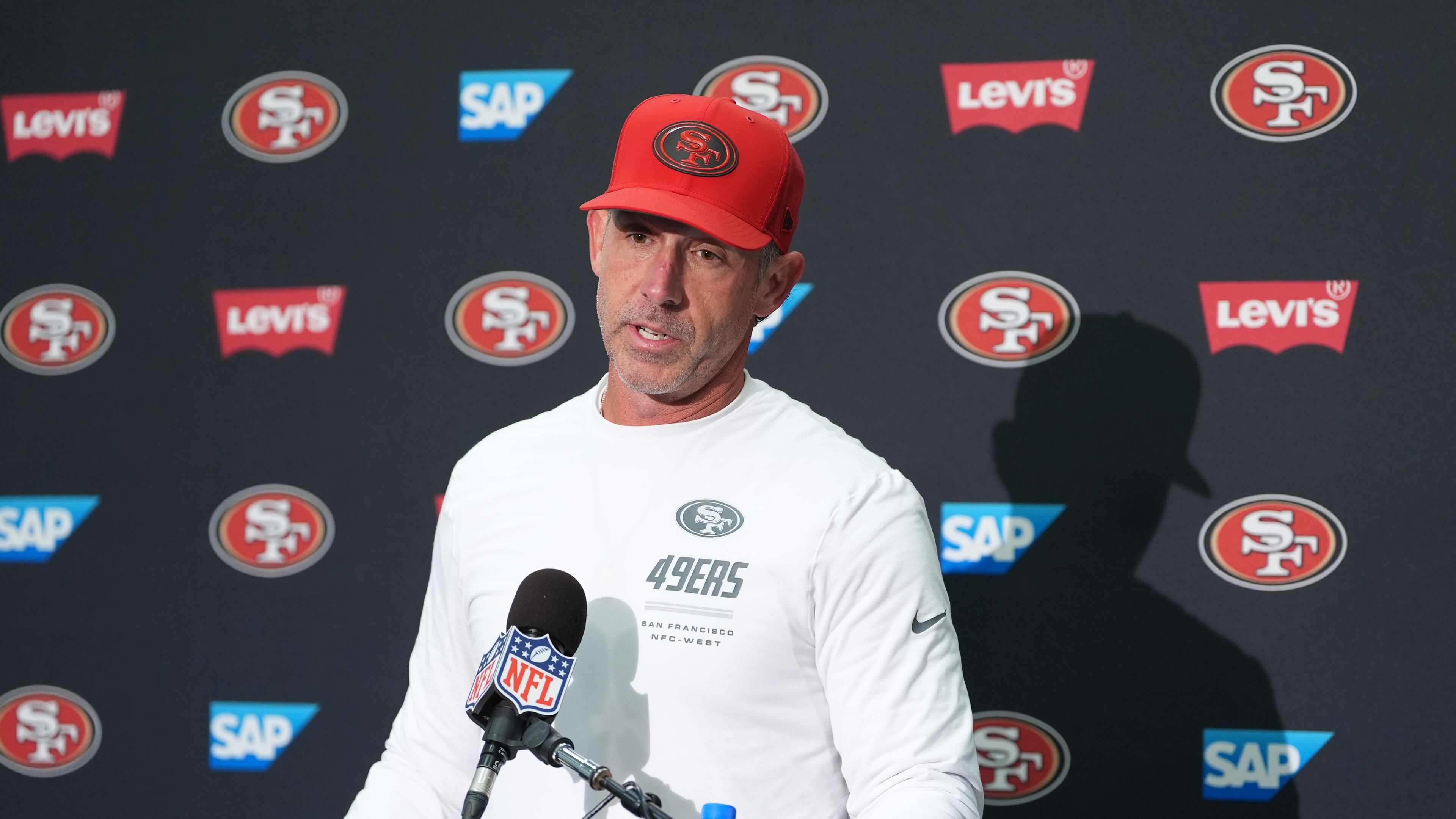 San Francisco 49ers head coach Kyle Shanahan speaks to reporters following an NFL football game against the Seattle Seahawks, Sunday, Oct. 11, 2026, in Seattle. (AP Photo/Lindsey Wasson)