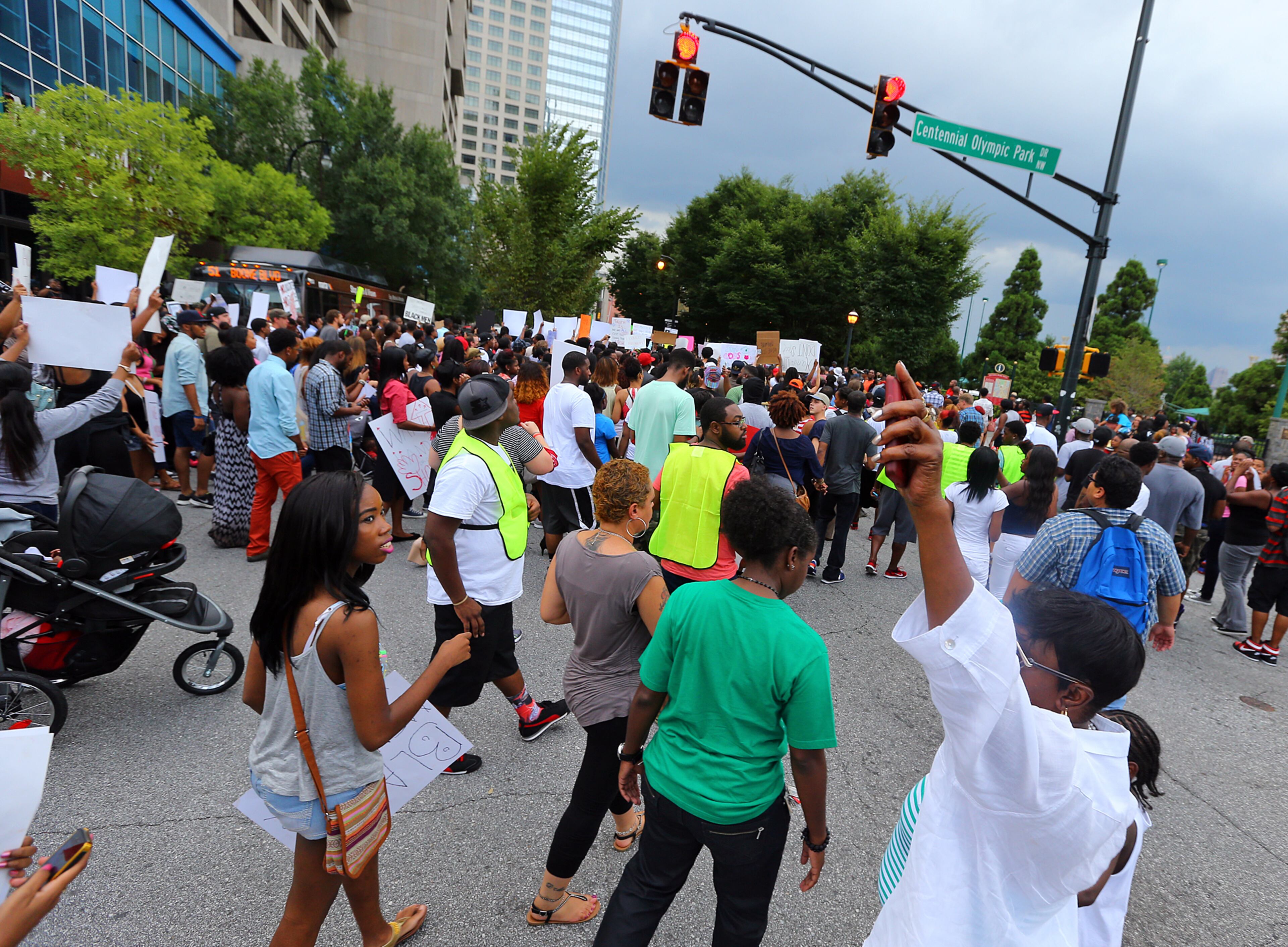081814 Atlanta: Protesters fill Marietta Street as they begin to march from a rally for Mike Brown and Ferguson from the CNN Center on Monday, August 18, 2014, in Atlanta. CURTIS COMPTON / CCOMPTON@AJC.COM