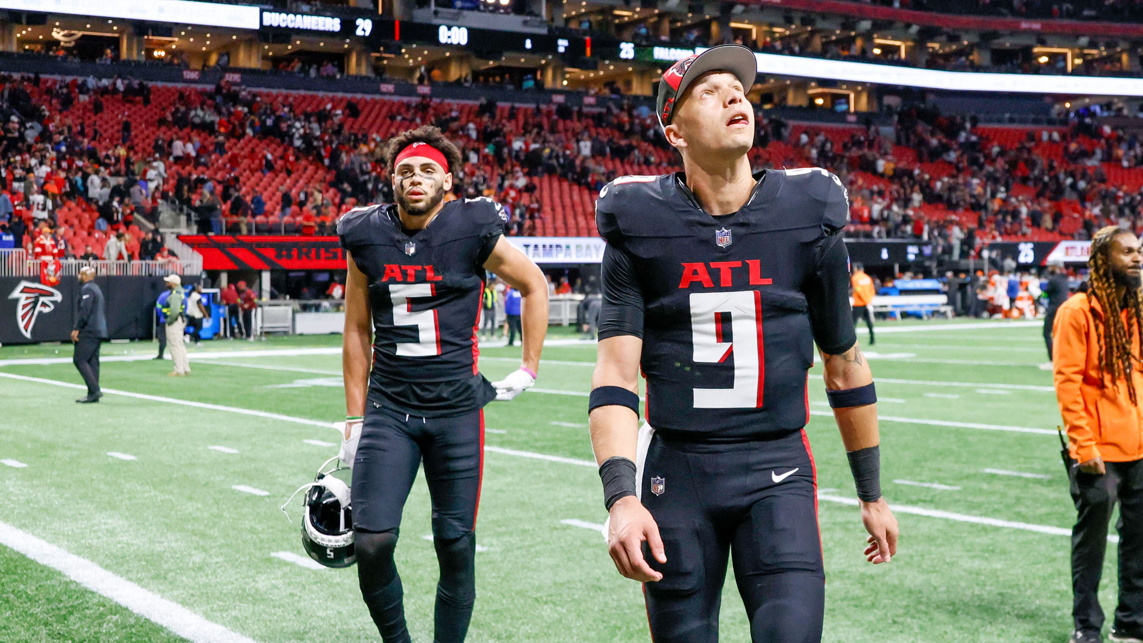 Atlanta Falcons quarterback Desmond Ridder (9) looks up as he leaves the field, followed by Atlanta Falcons wide receiver Drake London (5) after the Falcons lose against the Tampa Bay Buccaneers 29-25 at Mercedes-Benz Stadium on Sunday, Dec. 10, 2023.
Miguel Martinez/miguel.martinezjimenez@ajc.com