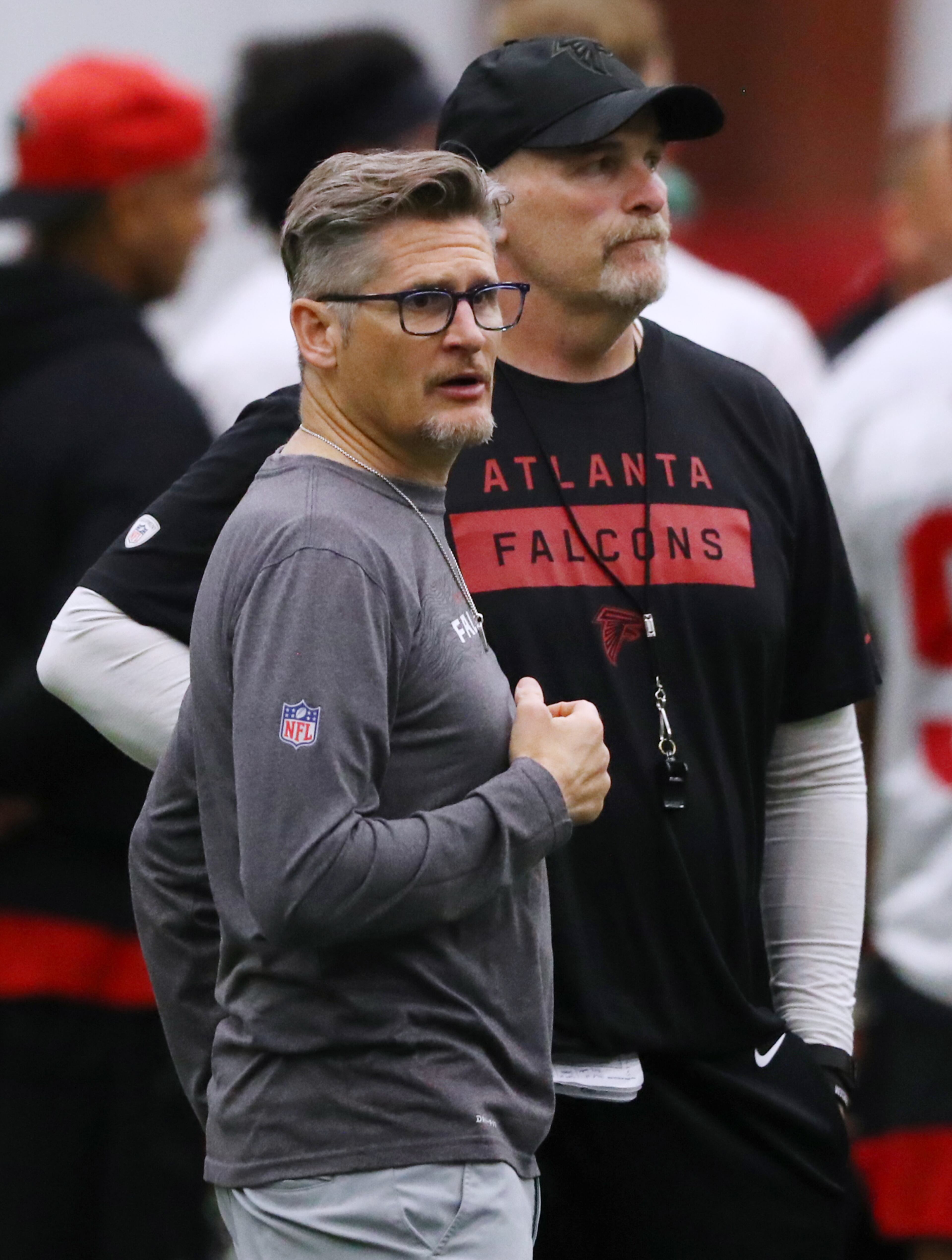 Falcons general manager Thomas Dimitroff and head coach Dan Quinn watch over the second day of rookie minicamp on Saturday, May 11, 2019, in Flowery Branch. Curtis Compton/ccompton@ajc.com