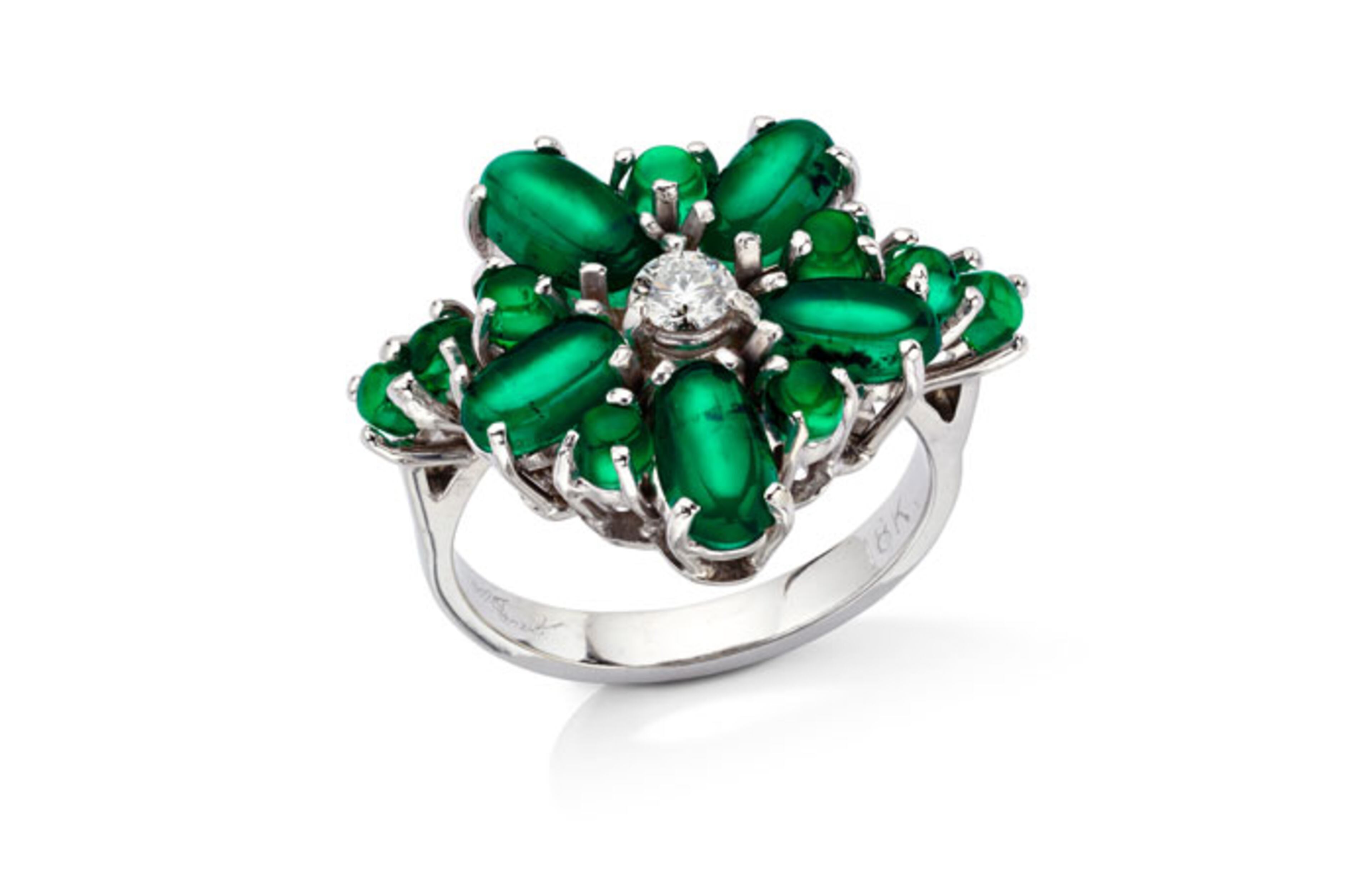 This ring is called the Cat's Eye Dream. Marcial de Gomar created this ring from a single cat's eye emerald from Muzo, Colombia.