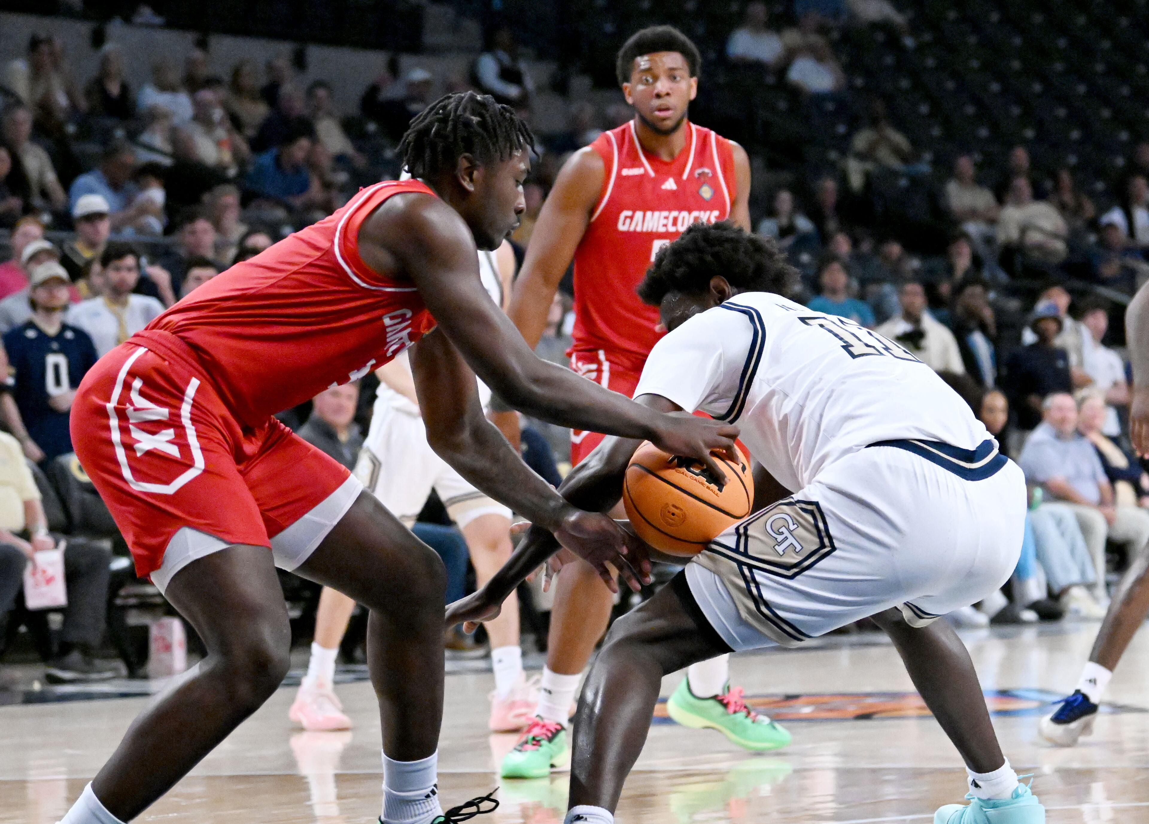 Jacksonville State guard Koree Cotton (left) steals a ball from Georgia Tech forward Baye Ndongo (11) during the second half of an NCAA college basketball game in the first round of the NIT, at Georgia Tech’s McCamish Pavilion, Tuesday, March 18, 2025, in Atlanta. Jacksonville State won 81-64 over Georgia Tech. (Hyosub Shin / AJC)