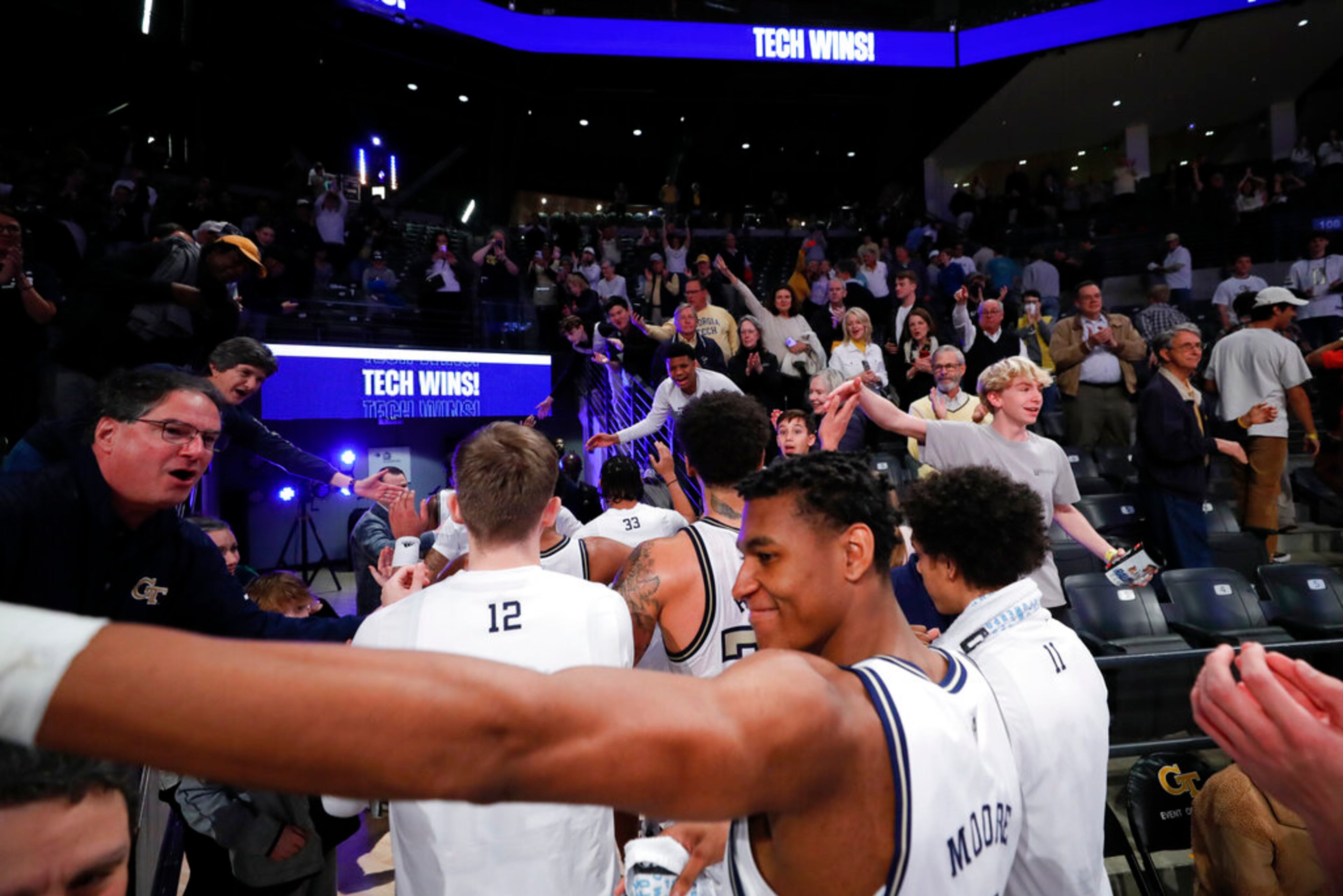 Fans greet Georgia Tech players after the team's 76-70 win over Miami in NCAA college basketball game Wednesday, Jan. 4, 2023, in Atlanta. (AP Photo/Alex Slitz)
