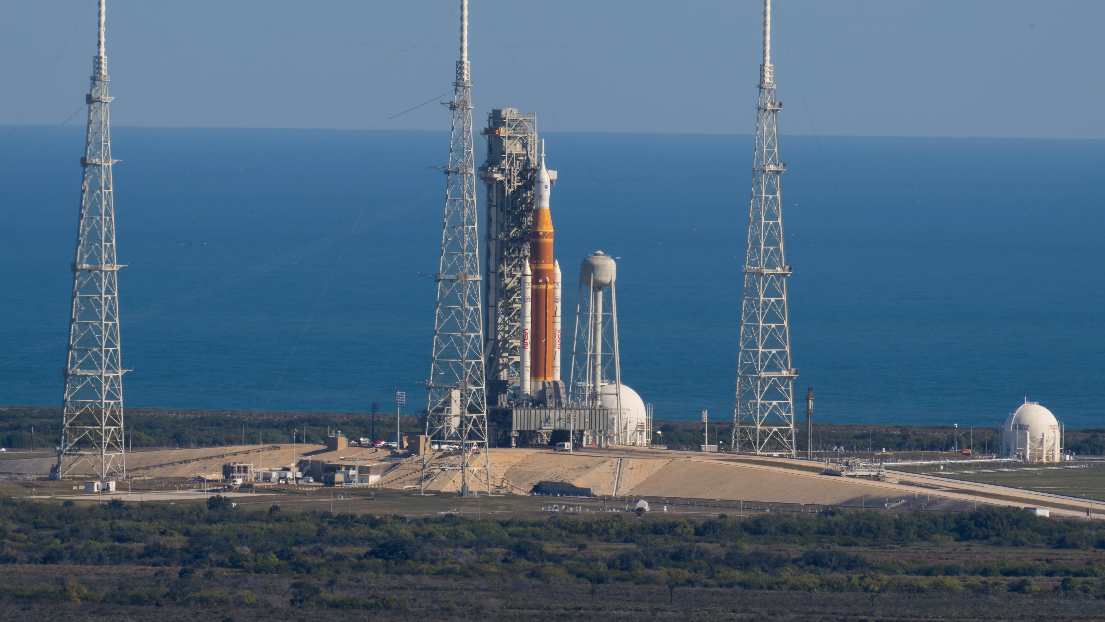 This photo provided by NASA shows the Artemis II SLS (Space Launch System) rocket with the Orion spacecraft atop a mobile launcher at Launch Complex 39B, Thursday, Jan. 29, 2026, at NASA's Kennedy Space Center in Florida. (Jim Ross/NASA via AP)