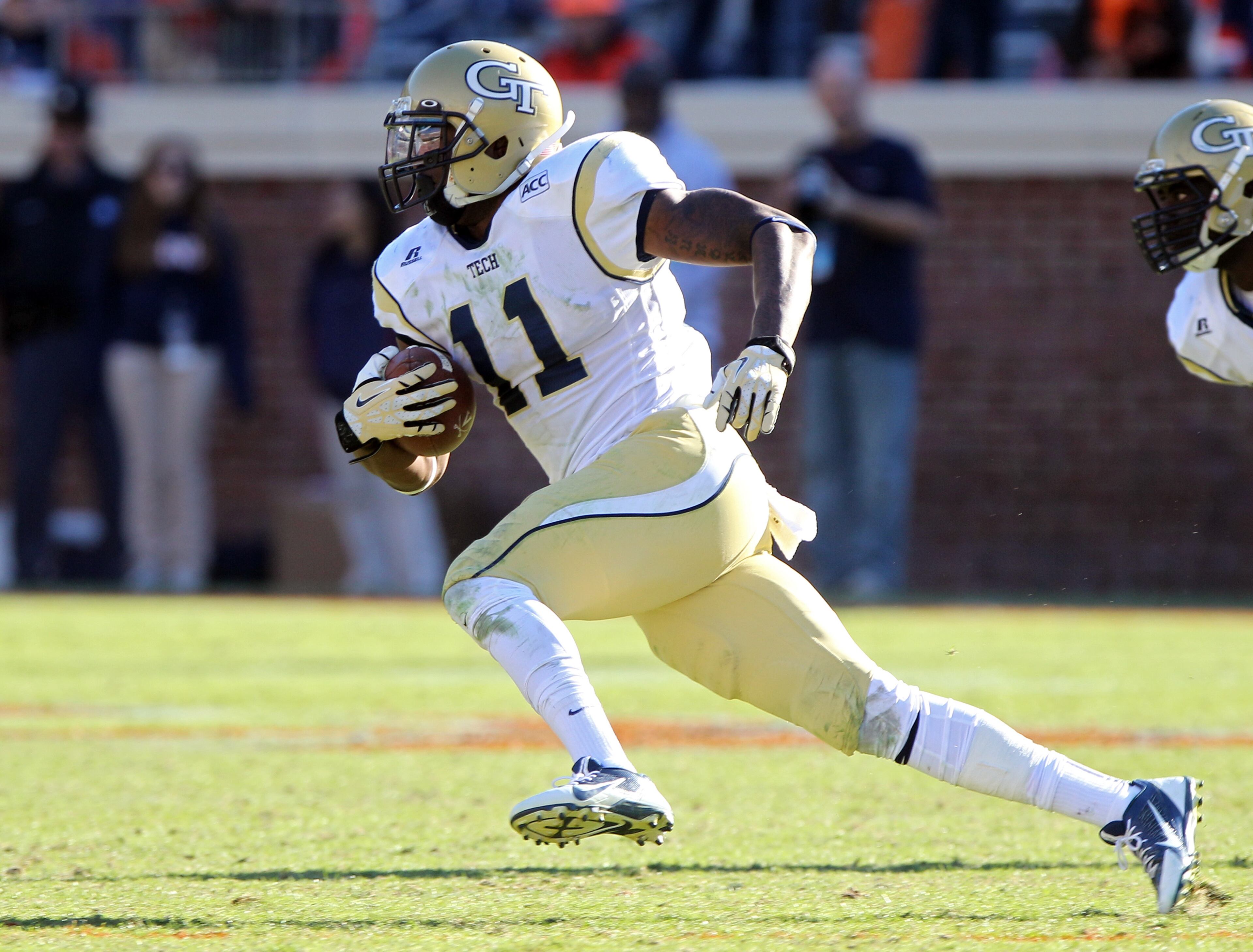 Georgia Tech linebacker Brandon Watts (11) runs the ball up field after intercepting a pass from Virginia quarterback David Watford late in the fourth quarter of an NCAA college football game Saturday, Oct. 26, 2013, at Scott Stadium in Charlottesville, Va. (AP Photo/The Daily Progress, Ryan M. Kelly)