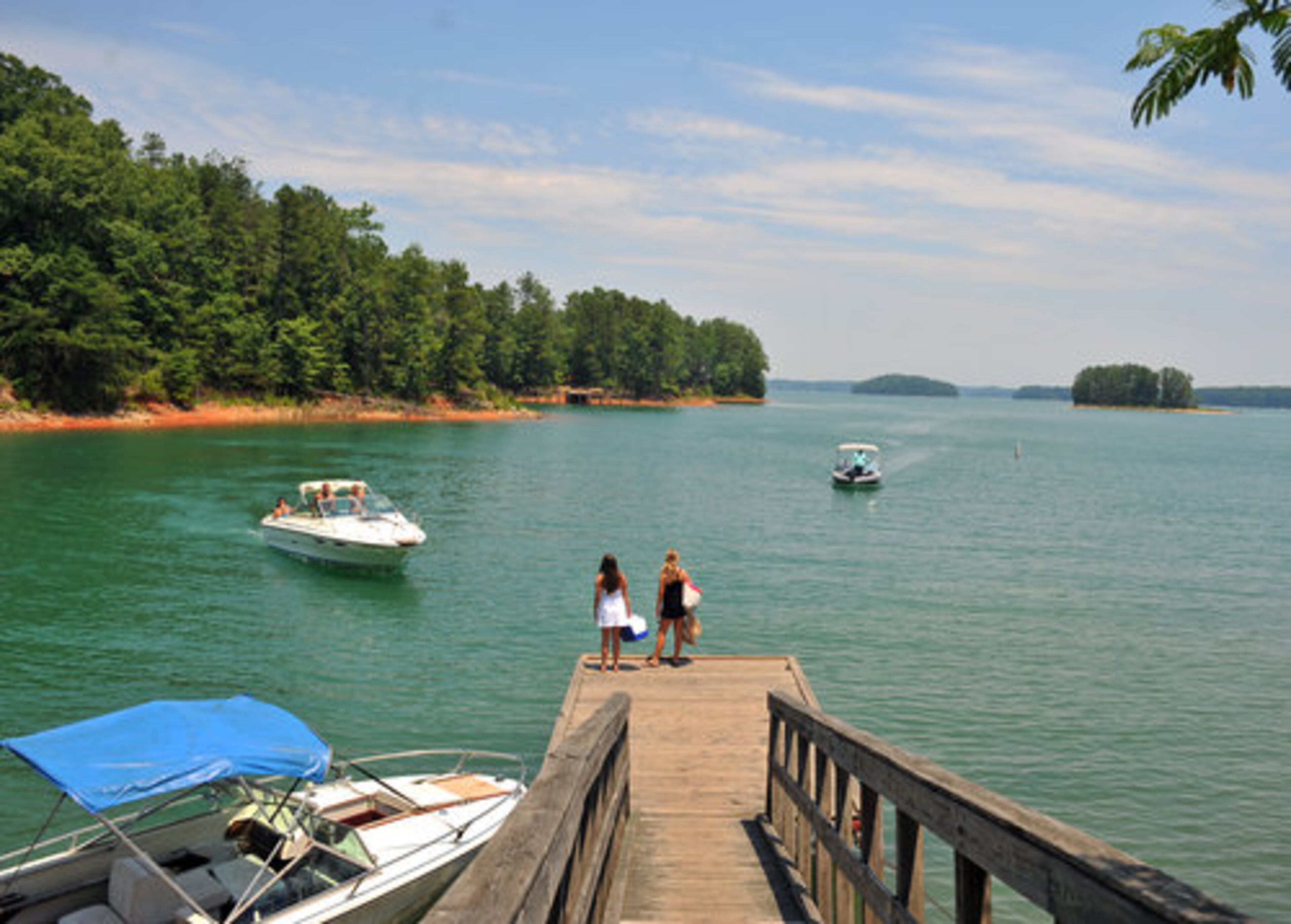 Gavin Cloy, a teacher from Alpharetta, said he was enjoying the revived lake with friends in his 24-foot bay boat. "It's not as dangerous," he said. "Last year, there was a lot of land out of water, and it could be hazardous, especially at night." With more ramps open this year, Cloy said access to the lake has been a breeze. Above, East Bank Park.