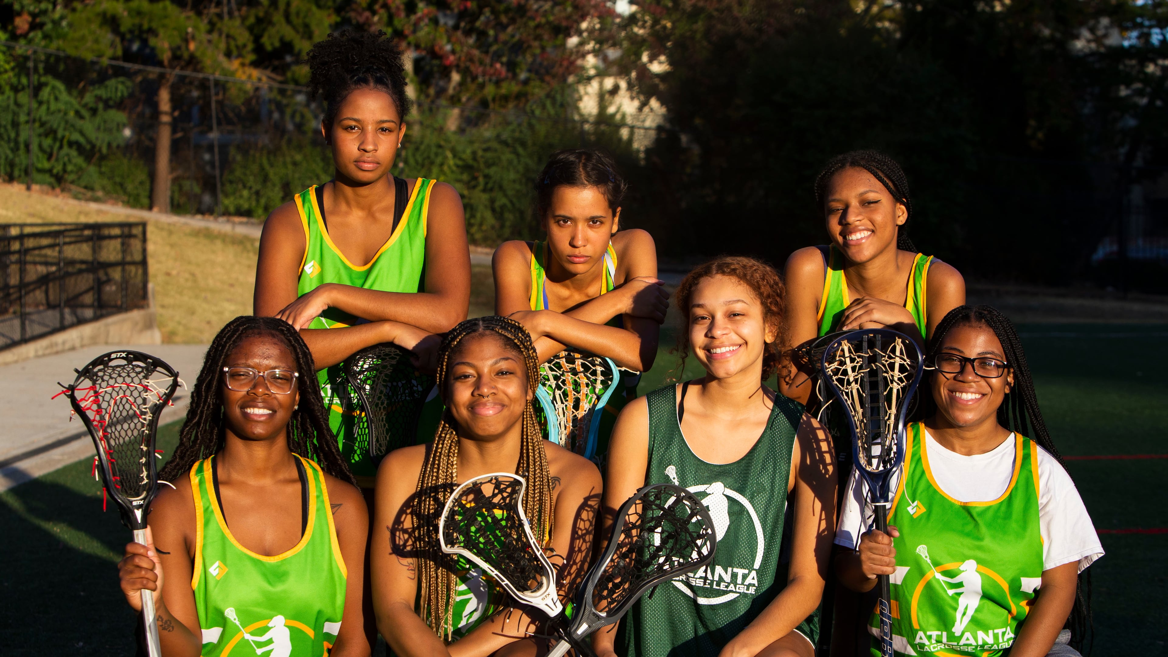 (Left to right, top row to bottom row) Olivia Robinson, Pauline Caldwell, Kalilah Kmt, Natajha Graham, Kaitlin Britton-Wheeler, Kyle Irwin and Deana Burris pose for a photo after the Spelman College lacrosse game on Sunday, October 23, 2022, at Hammond Park in Sandy Springs, Georgia. Several girls on the Spelman team said that joining the lacrosse team was the first time they felt a part of something on campus. CHRISTINA MATACOTTA FOR THE ATLANTA JOURNAL-CONSTITUTION.