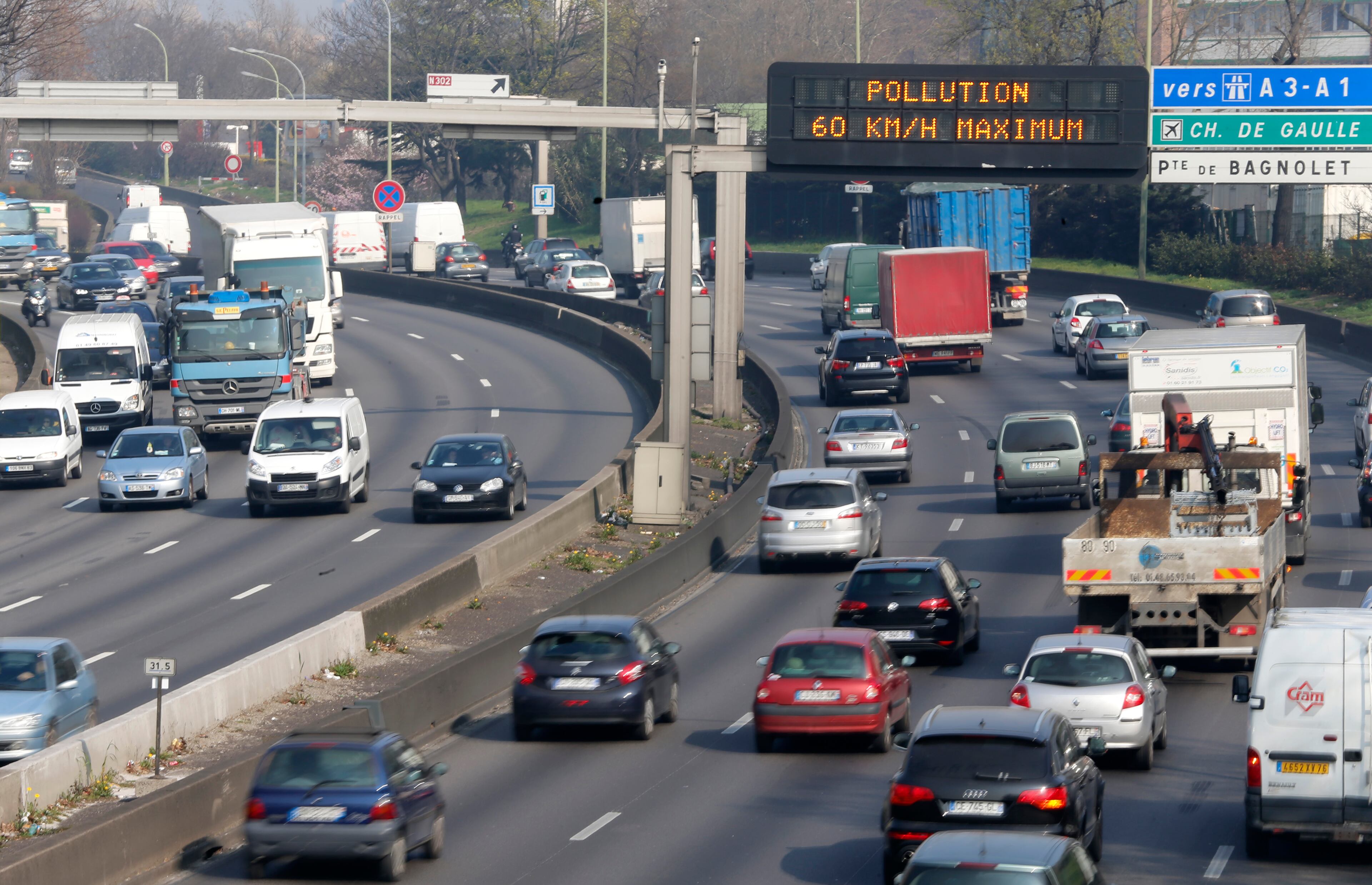 An electronic road sign reads "Pollution" on the Paris ring road, Friday March 14, 2014. Air pollution that has turned Paris skies a murky yellow is giving a break to millions of French travelers -- all public transportation in the Paris region and two other cities is free for the next three days. Nearly three-quarters of France is under alert in what the European Environment Agency says is the worst air pollution since 2007.