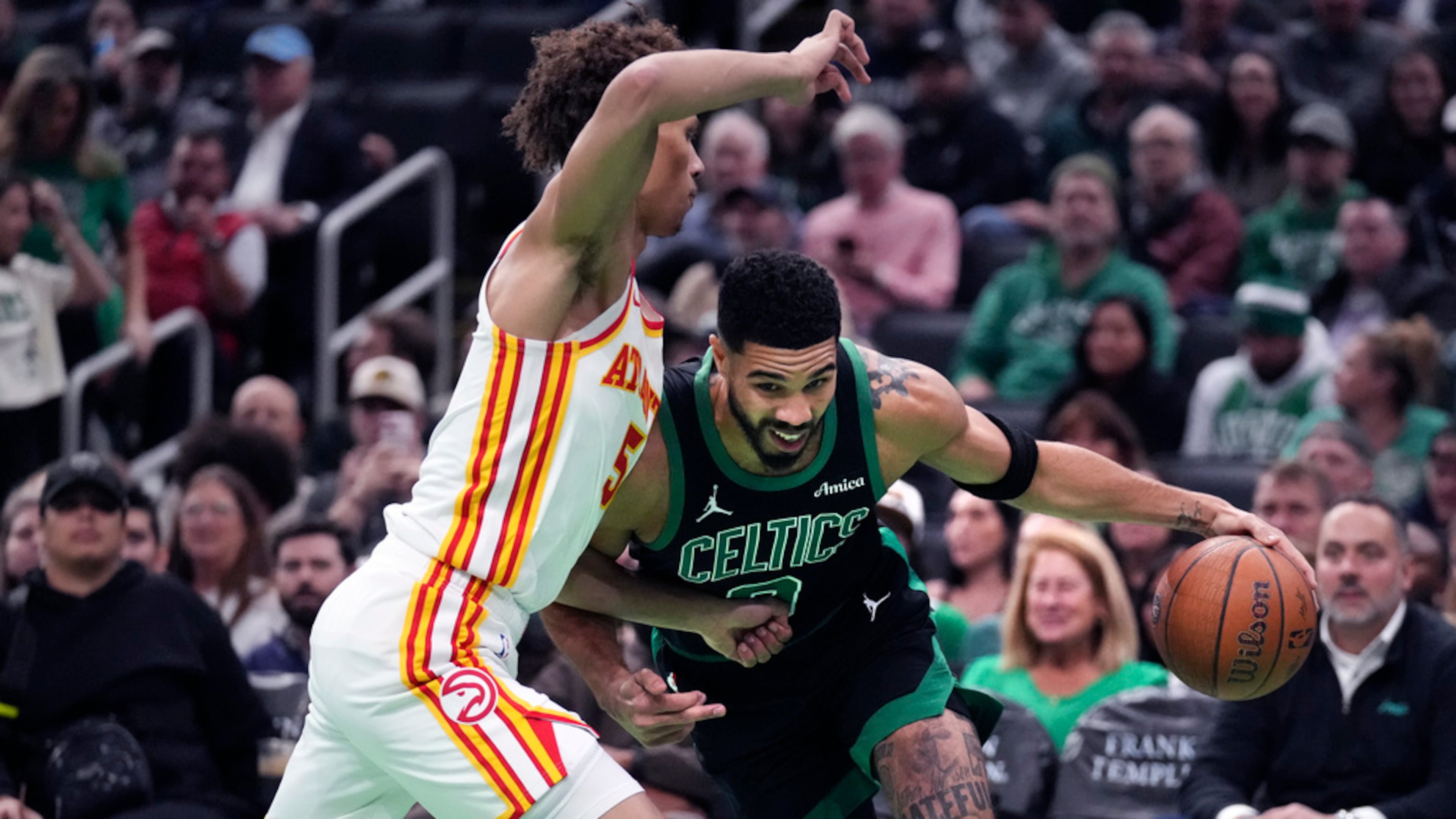 Boston Celtics forward Jayson Tatum drives to the basket against Atlanta Hawks guard Dyson Daniels during the first half of an Emirates NBA Cup basketball game, Tuesday, Nov. 12, 2024, in Boston. (Charles Krupa/AP)