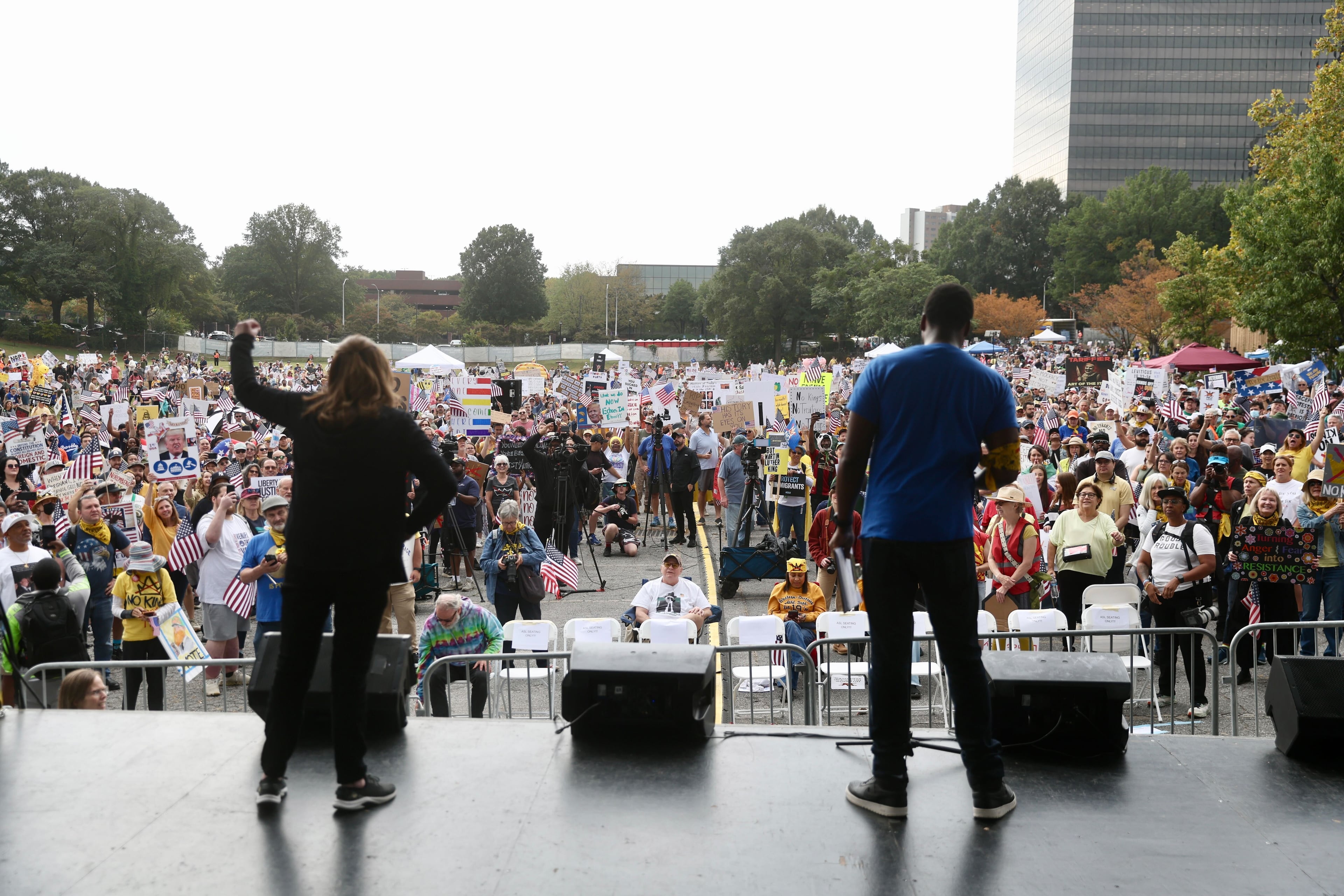 Speeches and music were part of the "No Kings" protest in the morning before the march. (Abbey Cutrer/AJC)