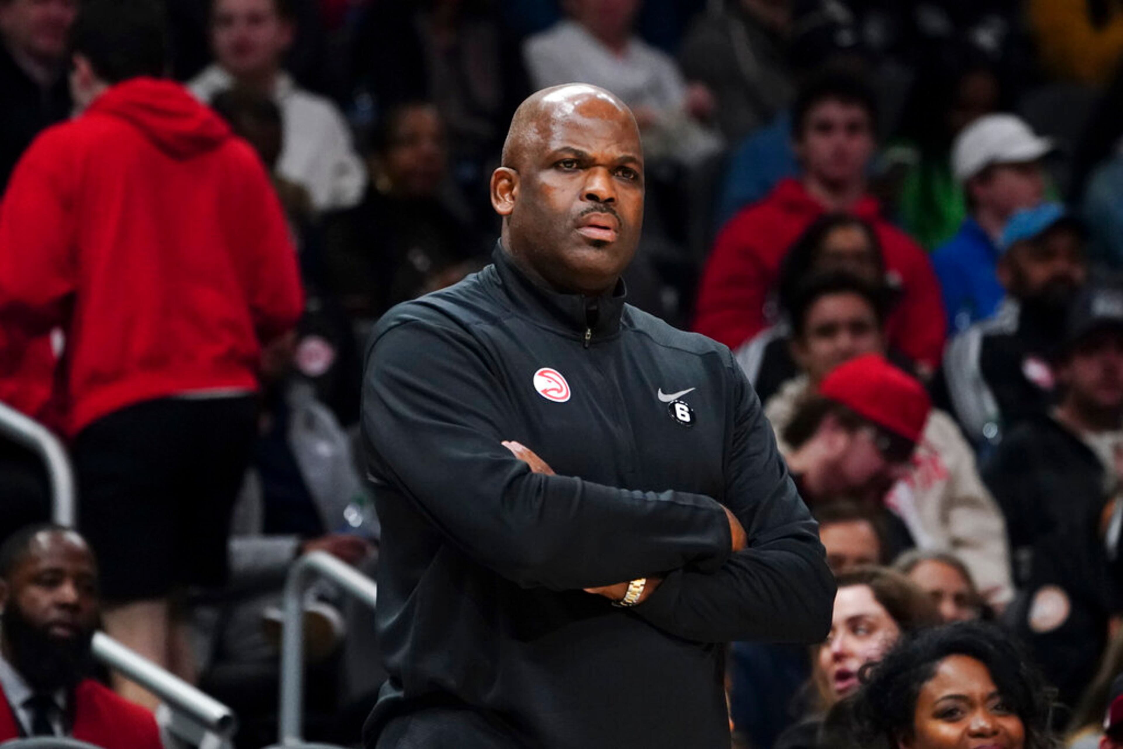 Atlanta Hawks coach Nate McMillan watches from the sideline during the first half of the team's NBA basketball game against the Charlotte Hornets on Saturday, Jan. 21, 2023, in Atlanta. (AP Photo/John Bazemore)