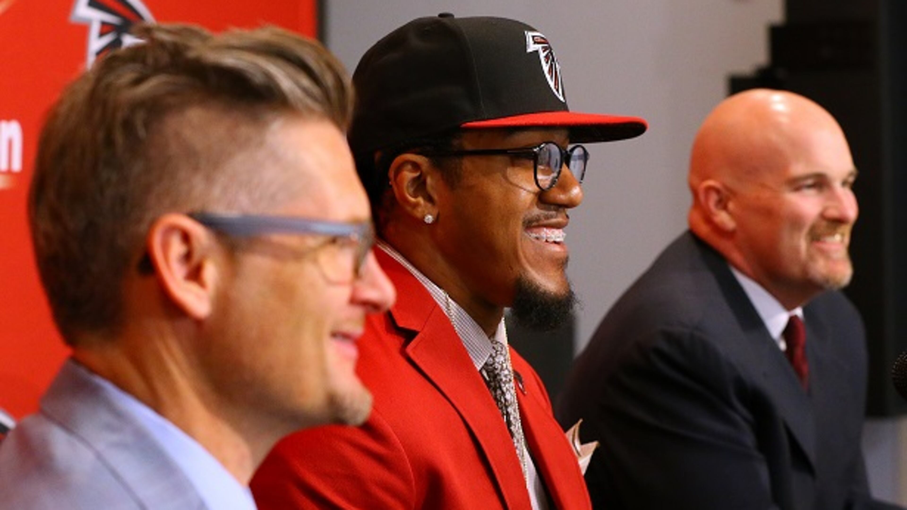 Atlanta Falcons General Manager Thomas Dimitroff, left, attends a news conference with first-round draft pick Vic Beasley, center, and head coach Dan Quinn at the Falcons training facility on Friday, May 1, 2015, in Flowery Branch, Ga. (Curtis Compton/Atlanta Journal-Constitution via AP) MARIETTA DAILY OUT; GWINNETT DAILY POST OUT; LOCAL TELEVISION OUT; WXIA-TV OUT; WGCL-TV OUT All smiles: Dimitroff, Beasley, Quinn. (Curtis Compton/AJC photo)