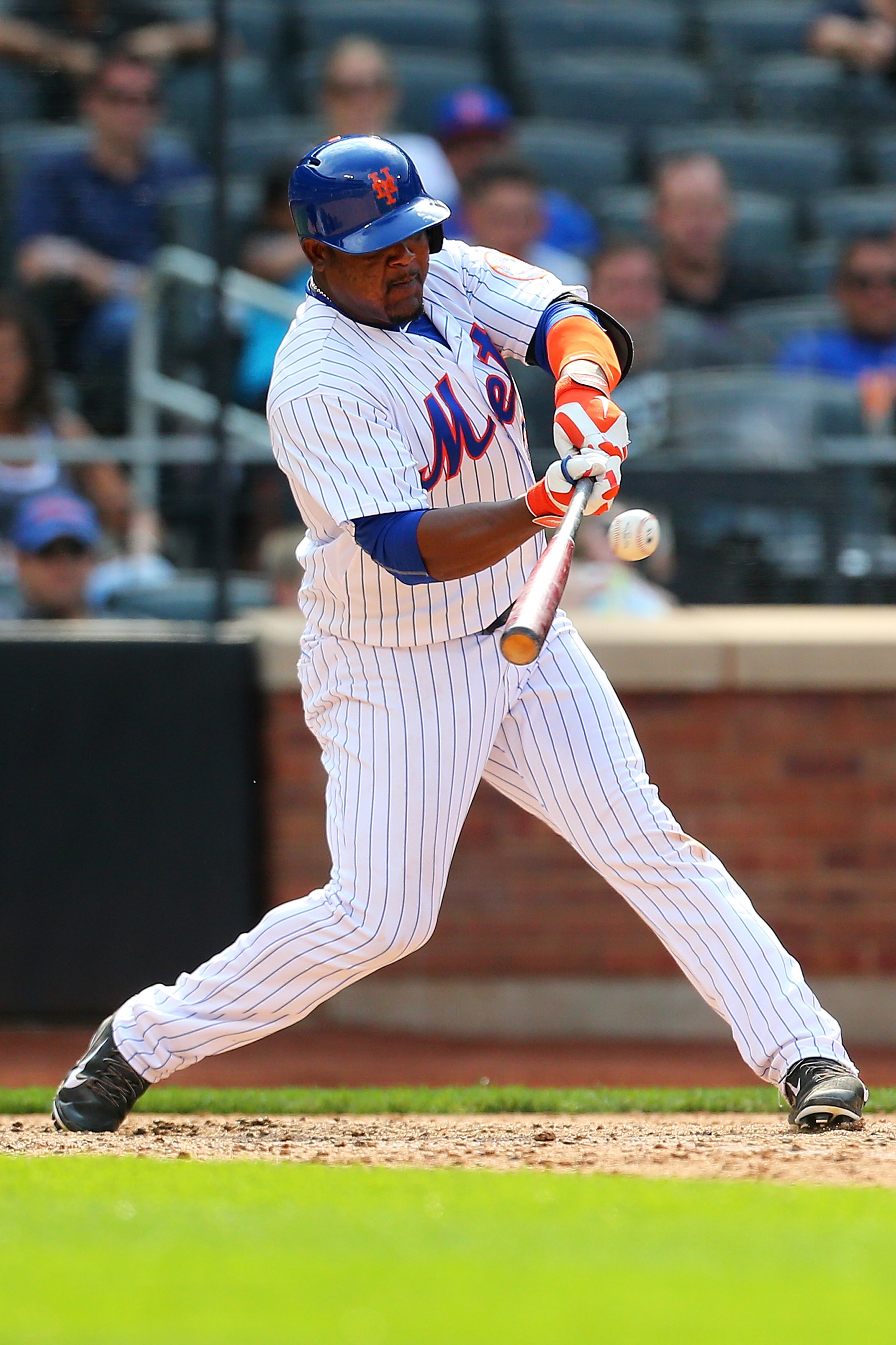 Juan Uribe #2 of the New York Mets connects on a game winning walk-off RBI single against the Los Angeles Dodgers in the tenth inning at Citi Field on July 26, 2015 in Flushing neighborhood of the Queens borough of New York City. Mets defeated the Dodgers 3-2 in ten inning. (Photo by Mike Stobe/Getty Images)