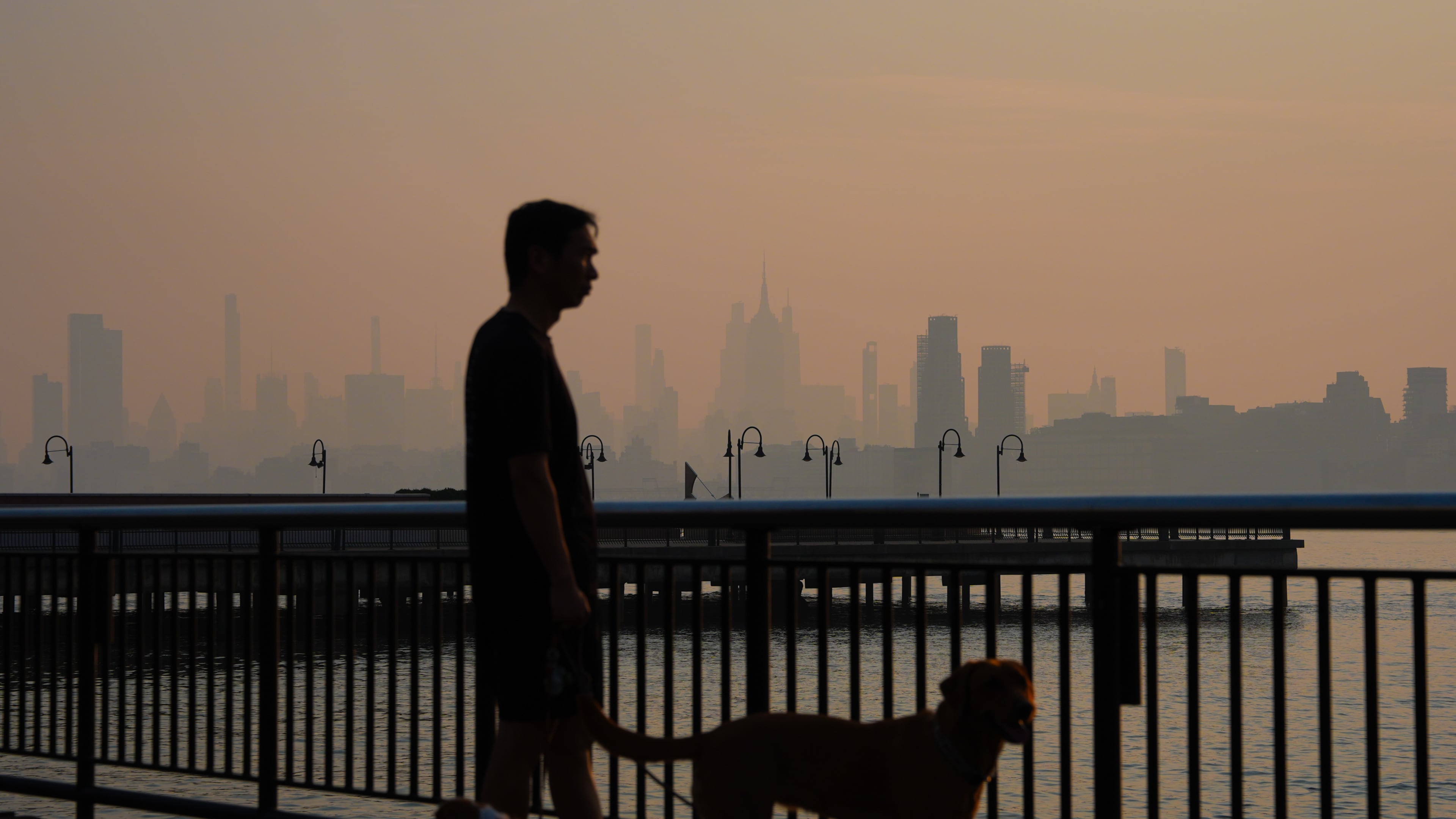 The New York City skyline is seen through a cover of wildfire smoke, in Jersey City, N.J., Friday, July 17, 2026. (AP Photo/Ryan Murphy)