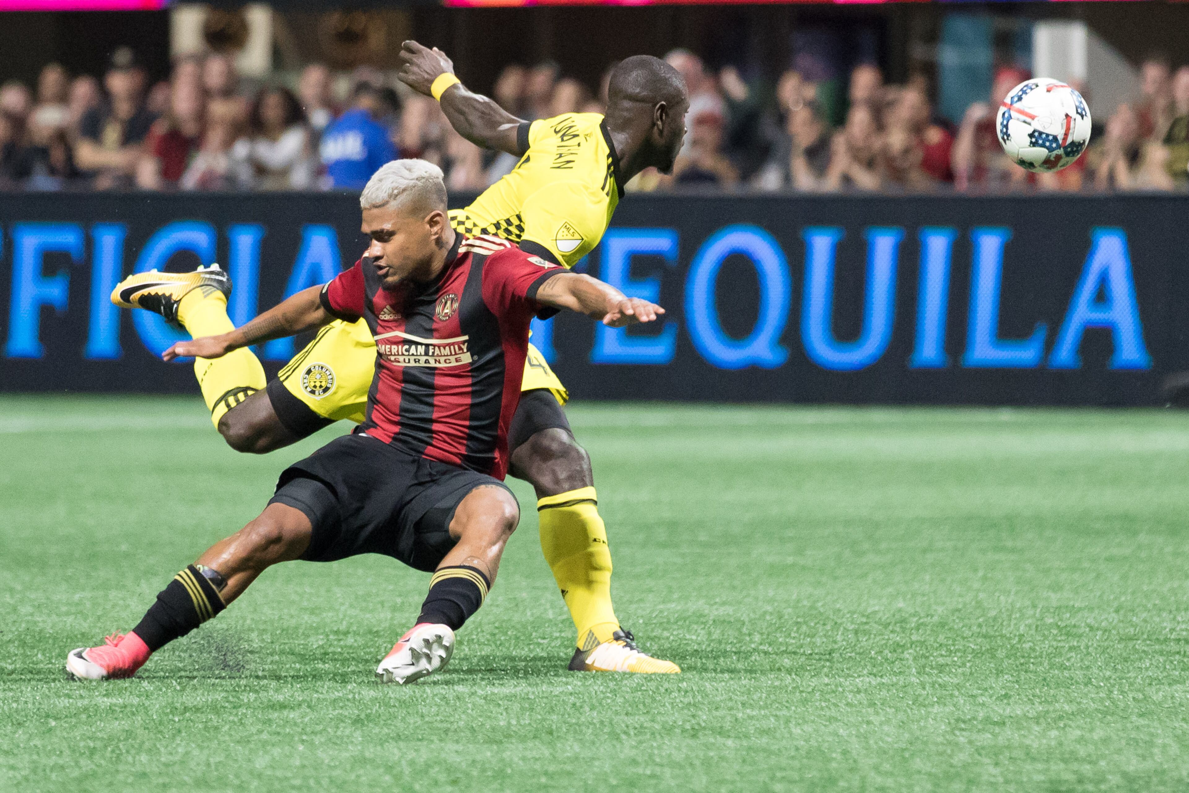 Atlanta United forward Josef Martinez (7) and Columbus Crew defender Jonathan Mensah (4) fight over the ball during an MLS game at Mercedes-Benz Stadium, Thursday, Oct. 26, 2017, in Atlanta. BRANDEN CAMP/SPECIAL