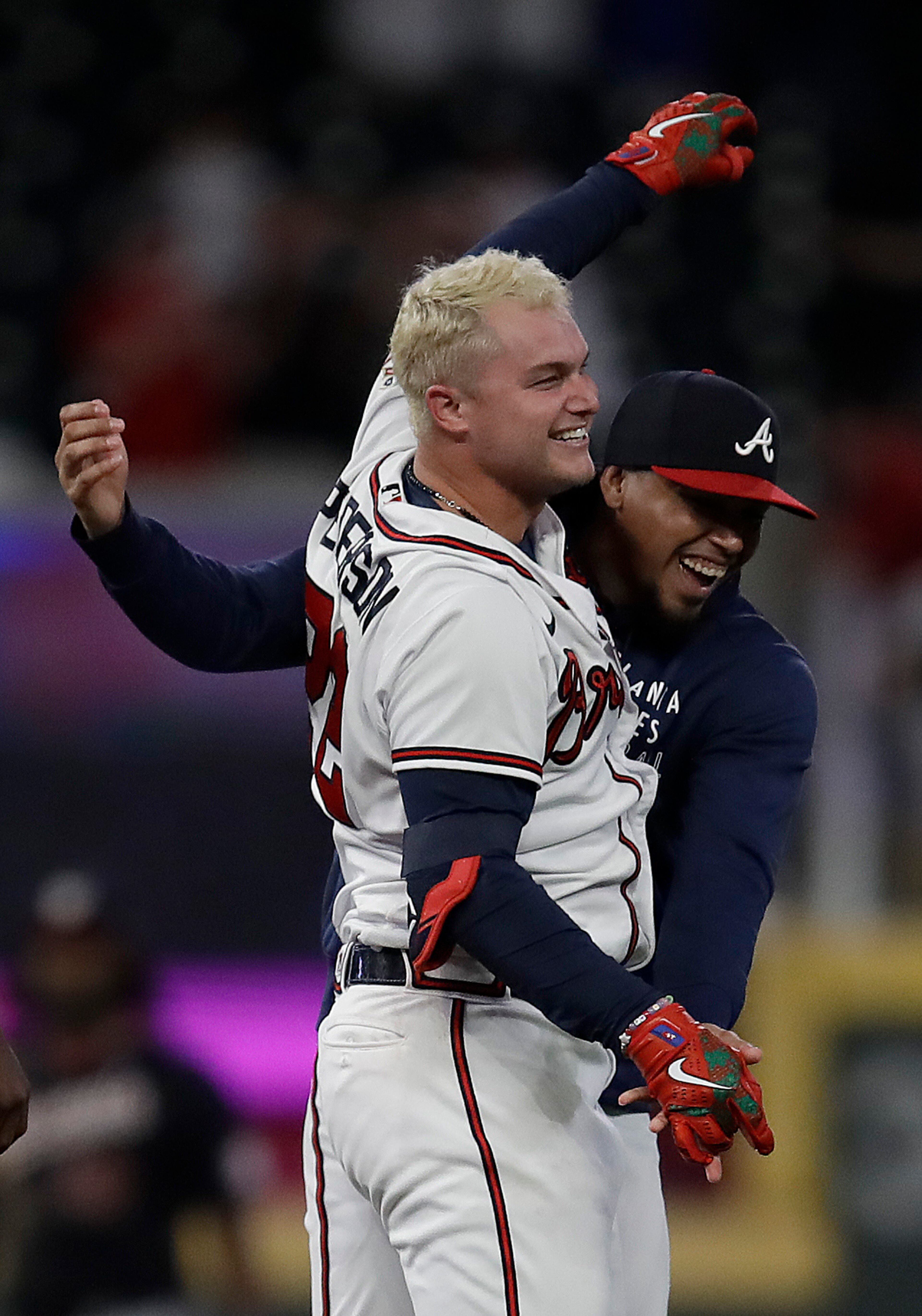 Atlanta Braves' Joc Pederson, left, celebrates after making the game winning hit against the Washington Nationals in the tenth inning of a baseball game Thursday, Sept. 9, 2021, in Atlanta. (AP Photo/Ben Margot)