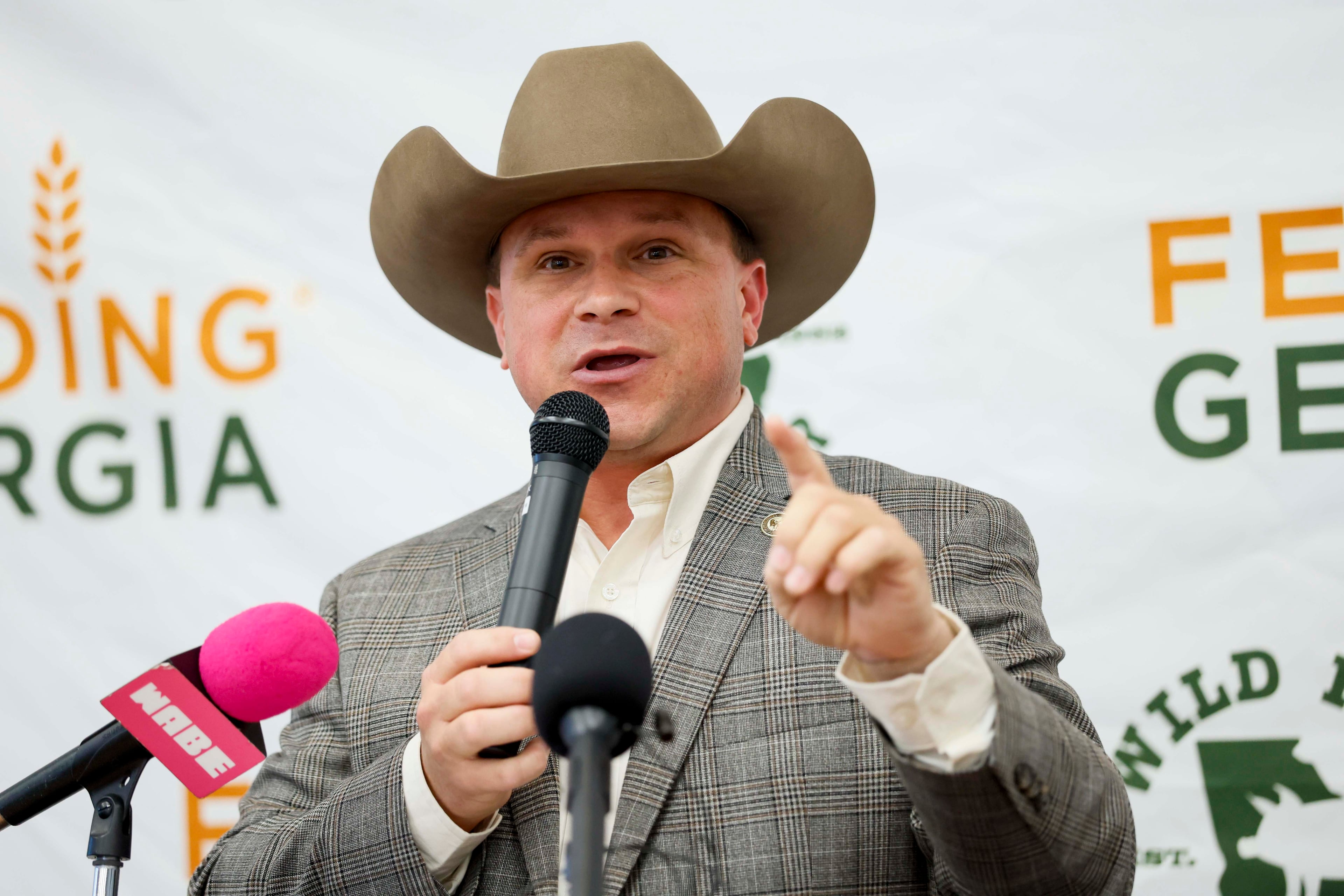 Agriculture Commissioner Tyler Harper addresses the crowd at the Wild Hog supper. (Miguel Martinez/AJC)