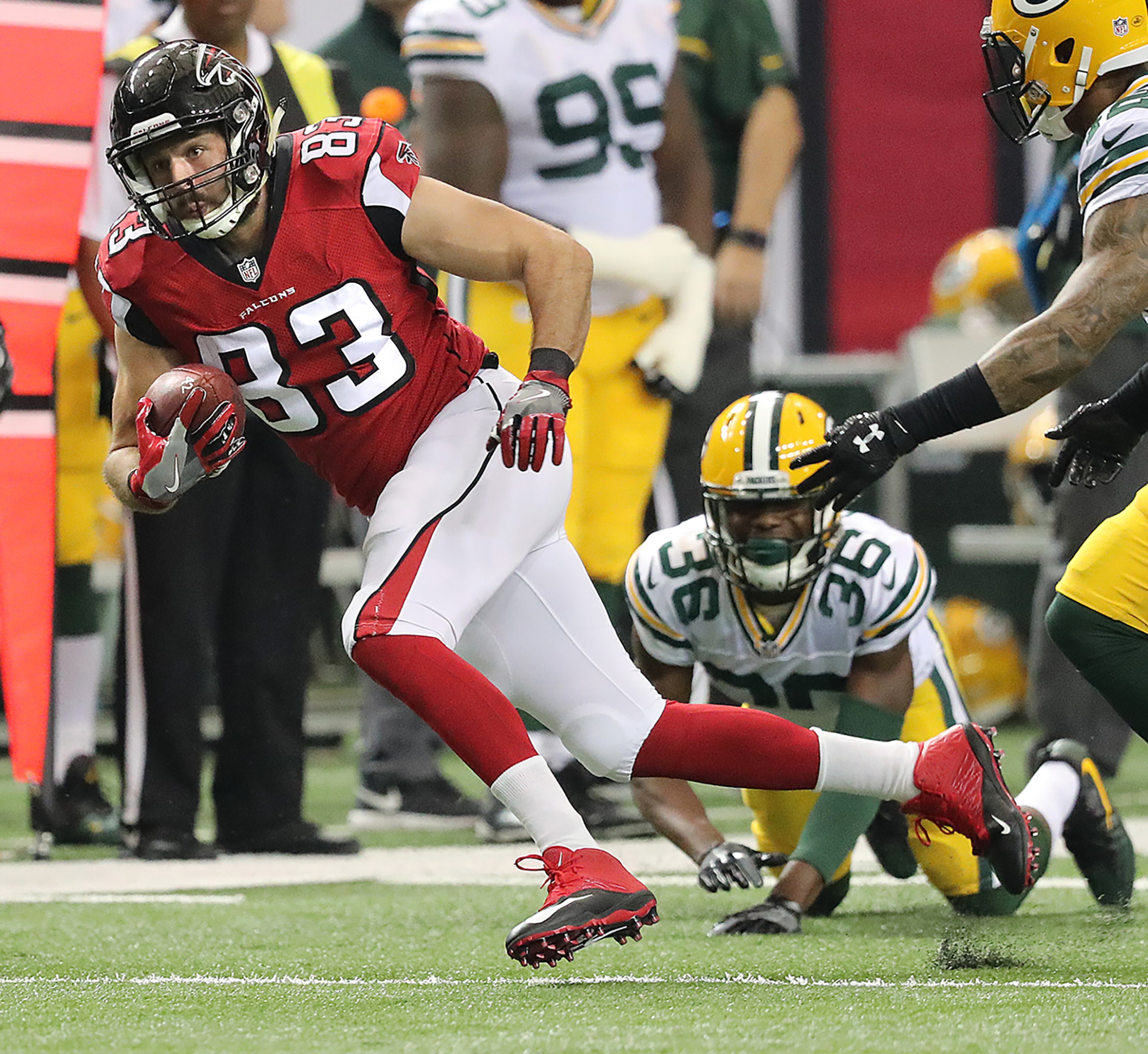 October 30, 2016 ATLANTA: Falcons tight end Jacob Tamme picks up yardage after catching a pass against the Packers during the first half in an NFL football game on Sunday, Oct. 30, 2016, in Atlanta. Curtis Compton /ccompton@ajc.com