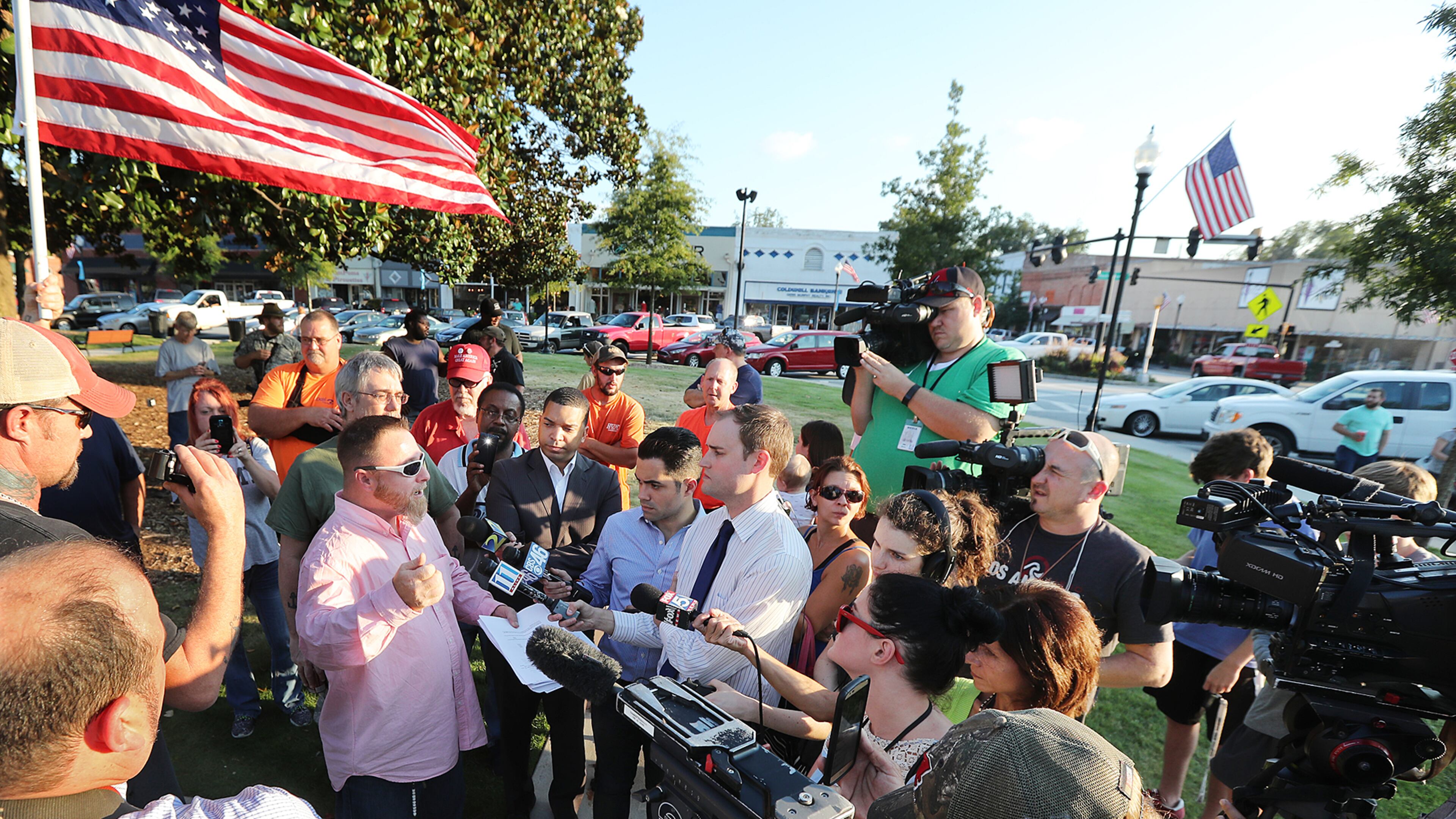 September 13, 2016 COVINGTON Chris Hill, commanding officer of the III% Georgia Security Force, speaks to the news media during a protest against building a mosque in Newton County held on the town square, Tuesday, Sept. 13, 2016, in Covington. Curtis Compton /ccompton@ajc.com