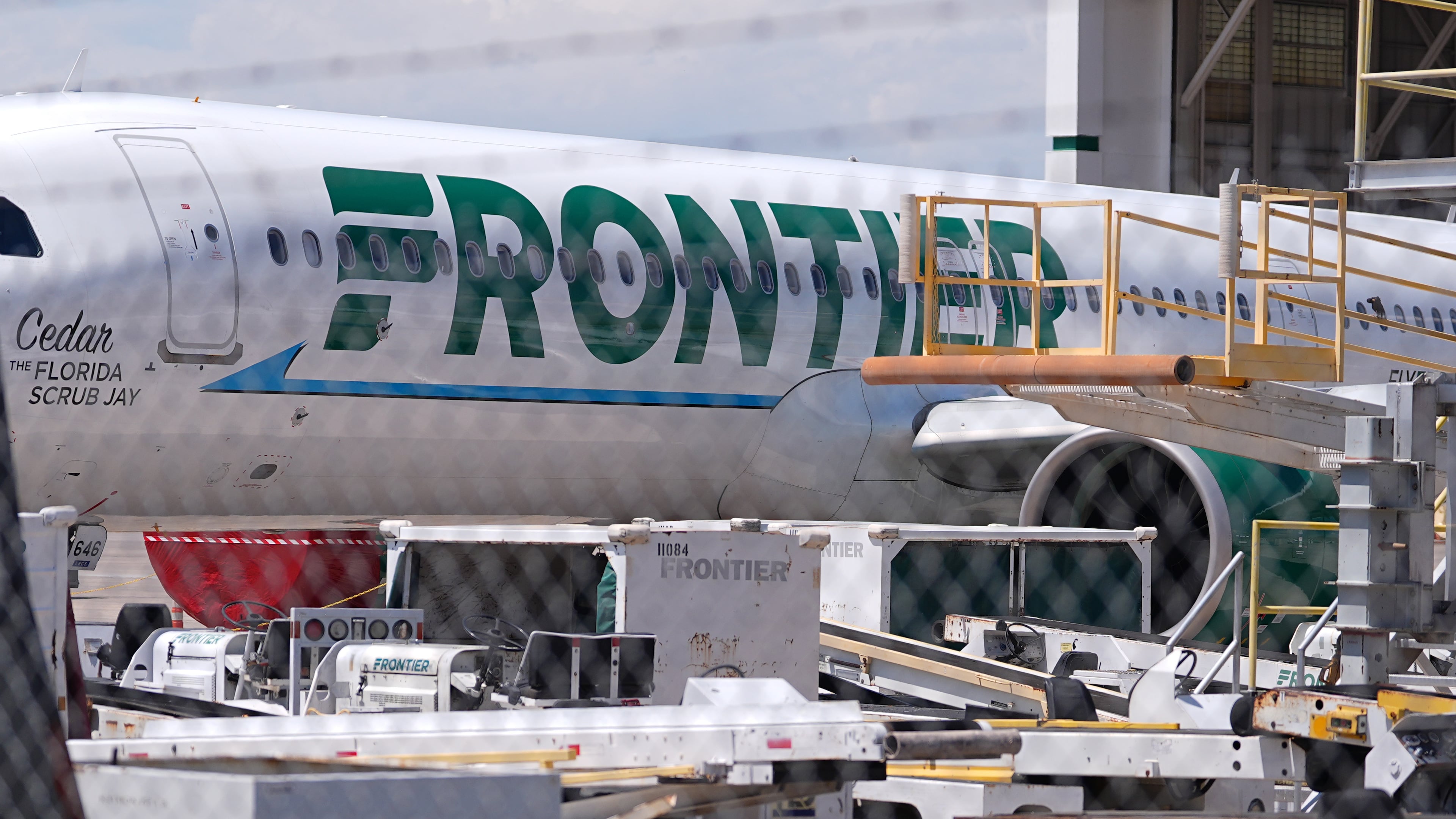 Frontier Airlines jetliner number n646fr sits outside the airlines technical operations center with other jetliners in for service north of Denver International Airport Saturday, May 9, 2026, in Denver. (AP Photo/David Zalubowski)
