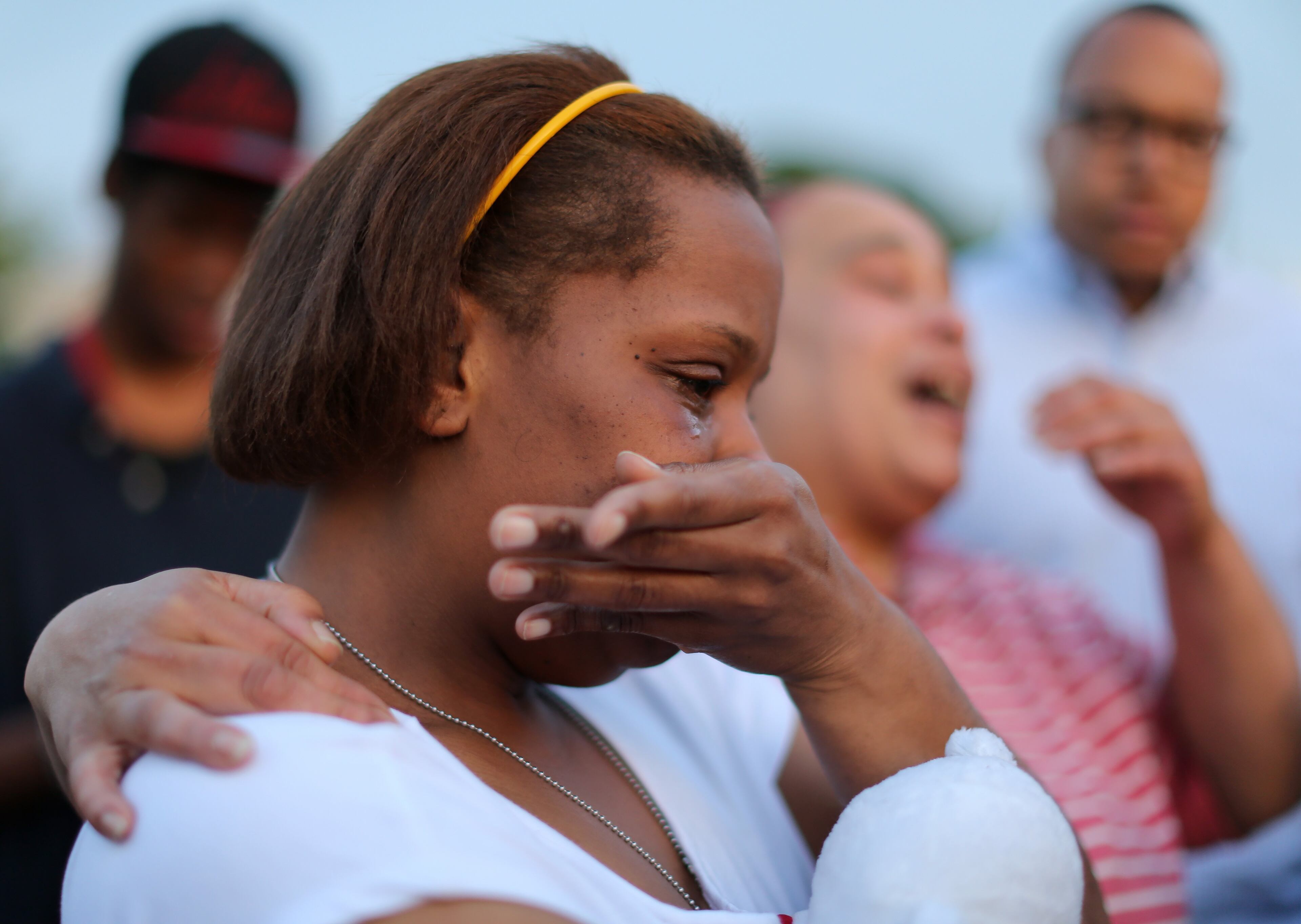 Michelle Ward cries before a vigil for her son Isaiah Ward on Wednesday evening April 20, 2016. Ward was hit and killed while walking on the sidewalk with his brother and a friend last Friday evening. Ben Gray / bgray@ajc.com