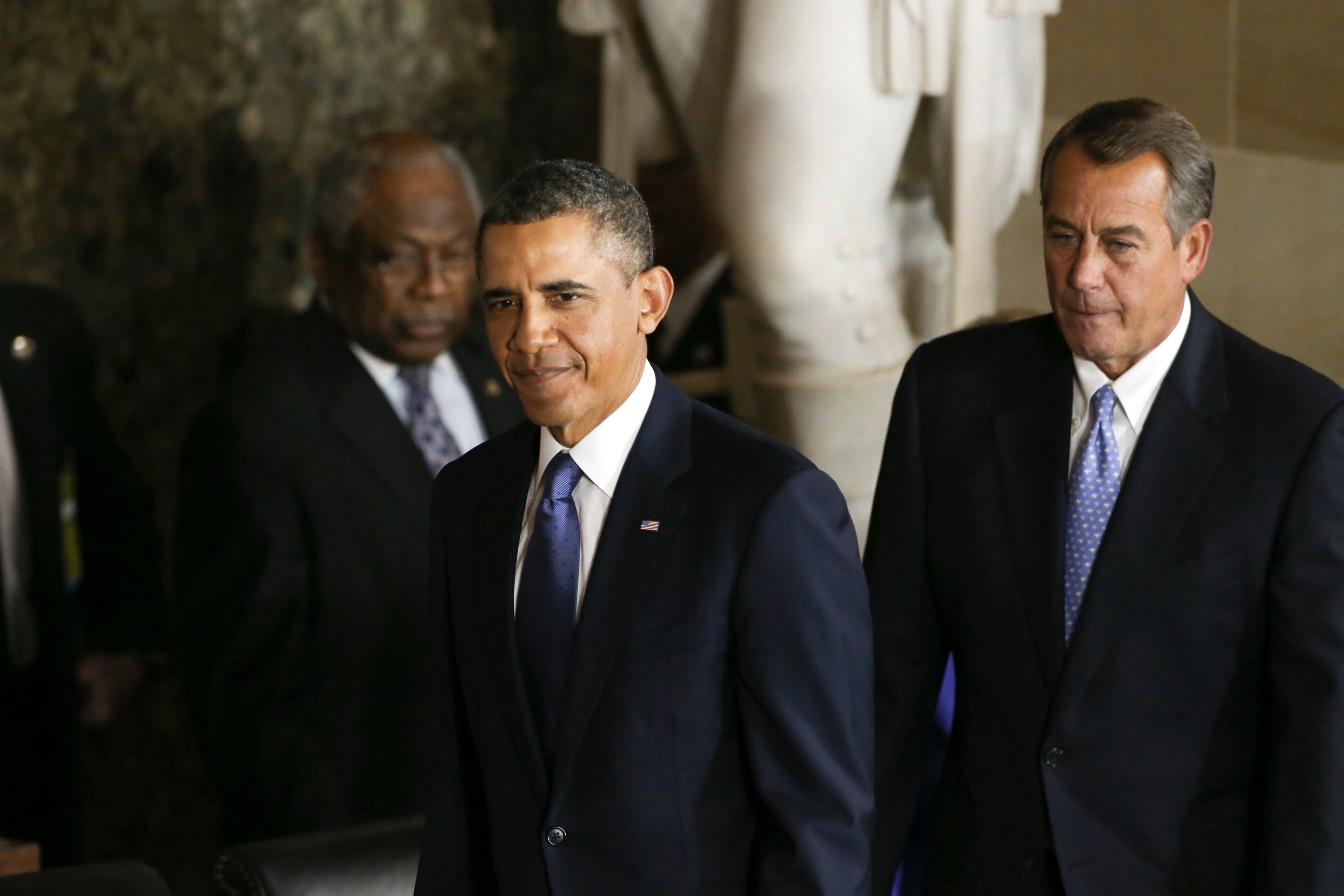 President Barack Obama and House Speaker John Boehner (R-Ohio) take part in the unveiling of a statue of Rosa Parks at the U.S. Capitol Building, in Washington, Feb. 27, 2013.
