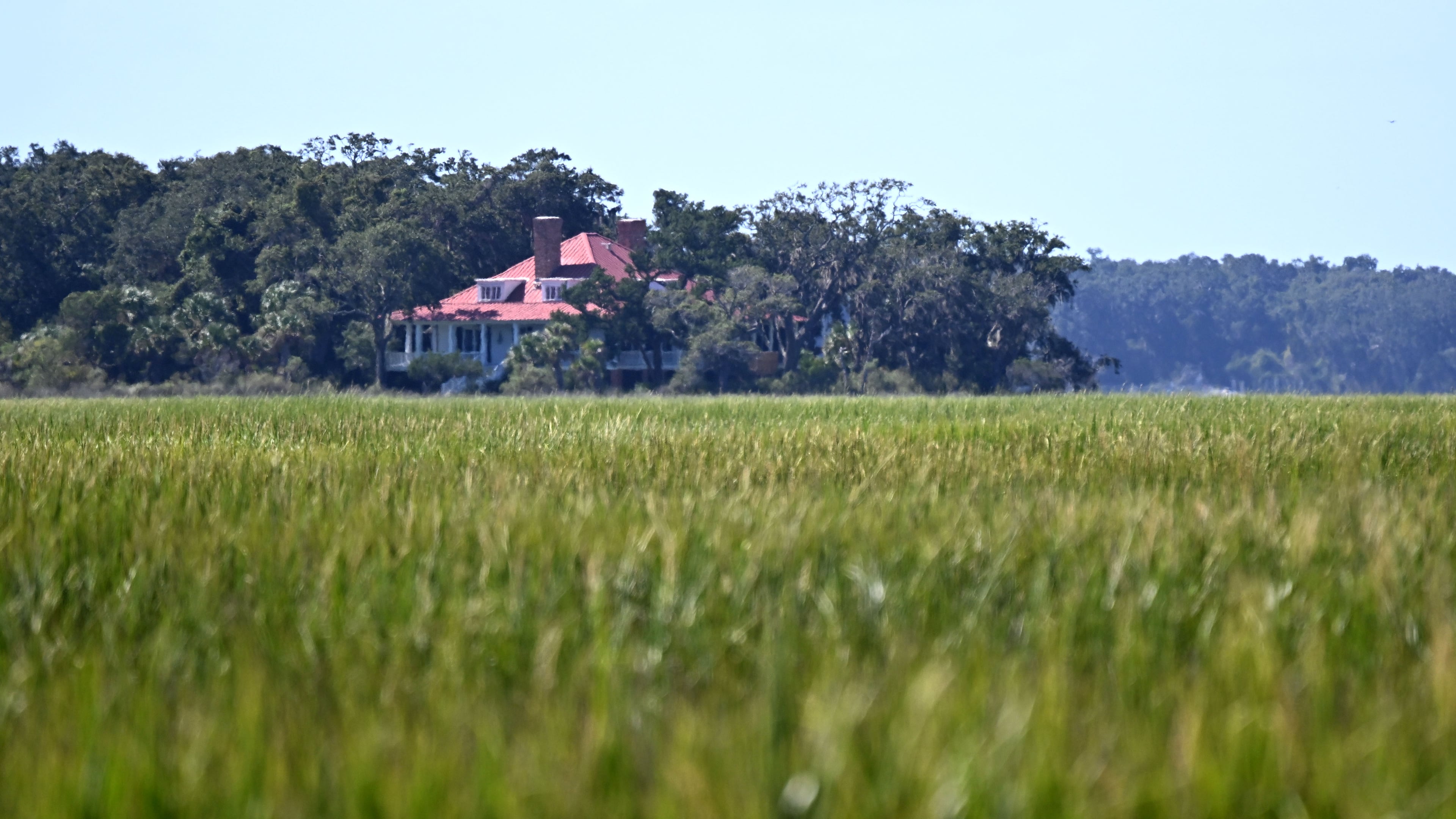 The view from property along Old House Creek on Georgia's Cumberland Island includes marshland and the historic Greyfield Inn. (Hyosub Shin/AJC)