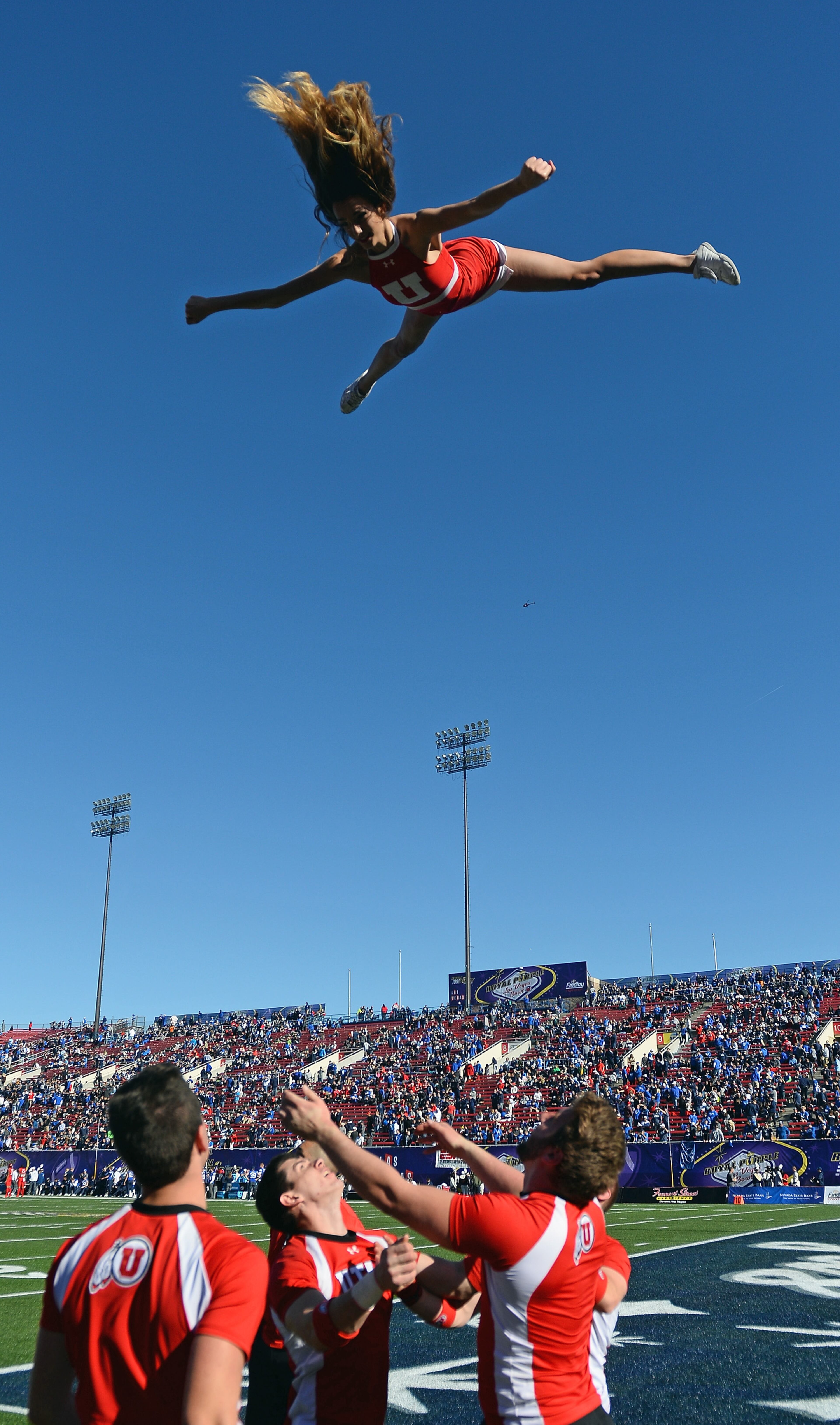 LAS VEGAS, NV - DECEMBER 19: Utah Utes cheerleaders perform before the team's game against the Brigham Young Cougars during the Royal Purple Las Vegas Bowl at Sam Boyd Stadium on December 19, 2015 in Las Vegas, Nevada. Utah won 35-28. (Photo by Ethan Miller/Getty Images)