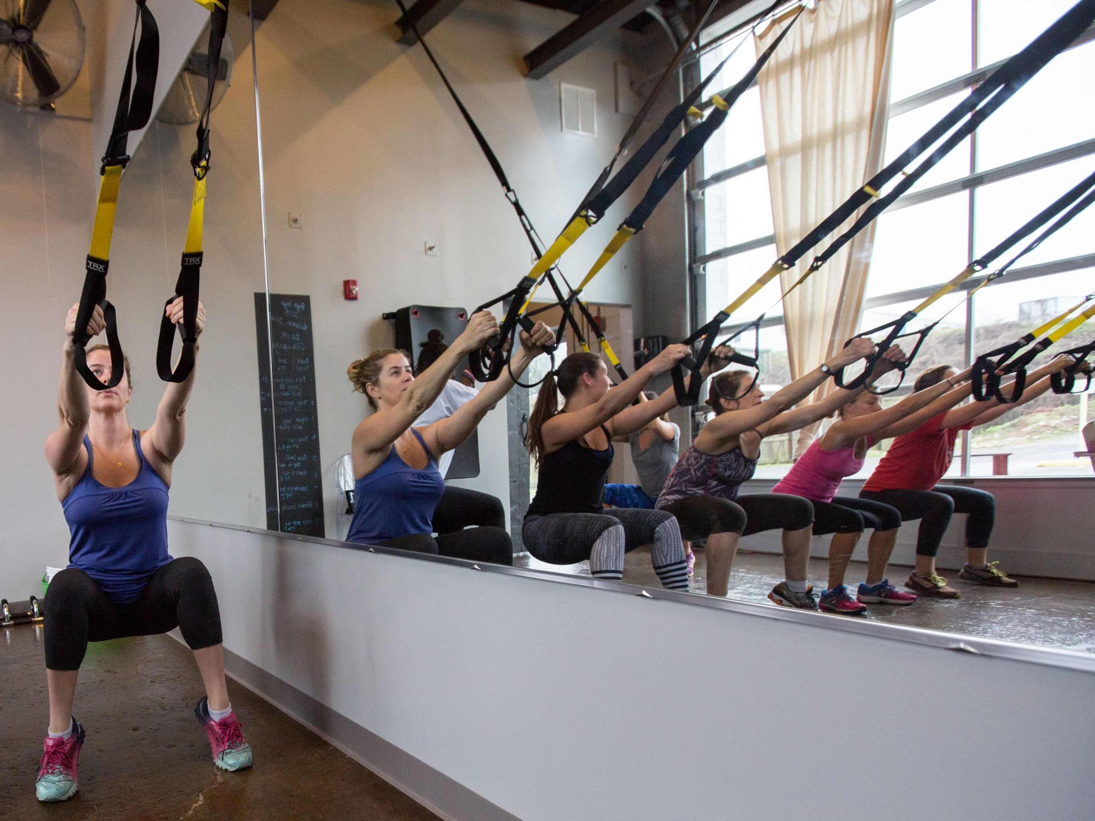 In this file photo, a group of women work out during a TRX class at Pace23 Indoor Cycling & TRX in Decatur. CONTRIBUTED BY BRANDEN CAMP 2015