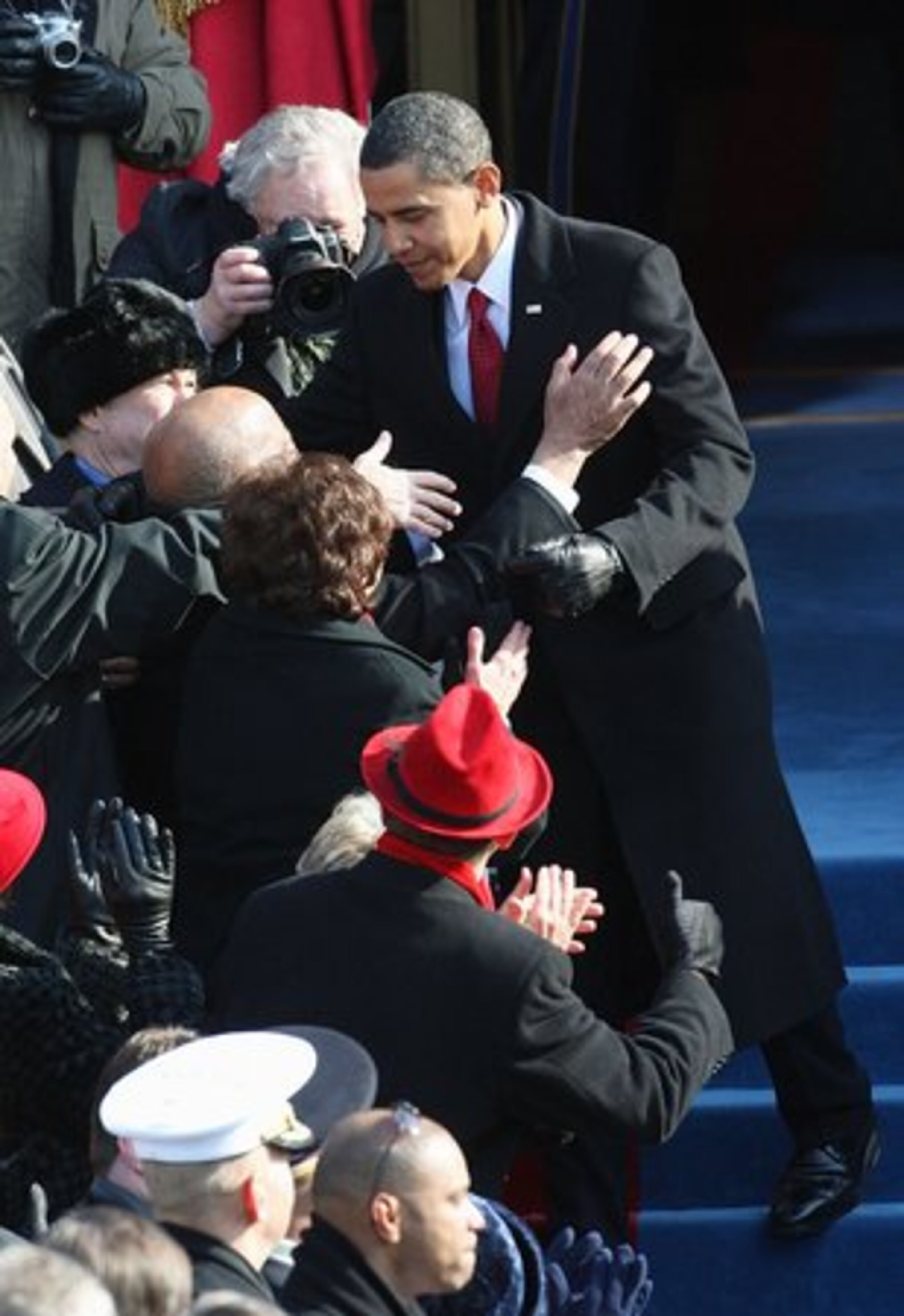 Obama is greeted as he arrives for swearing-in ceremonies.