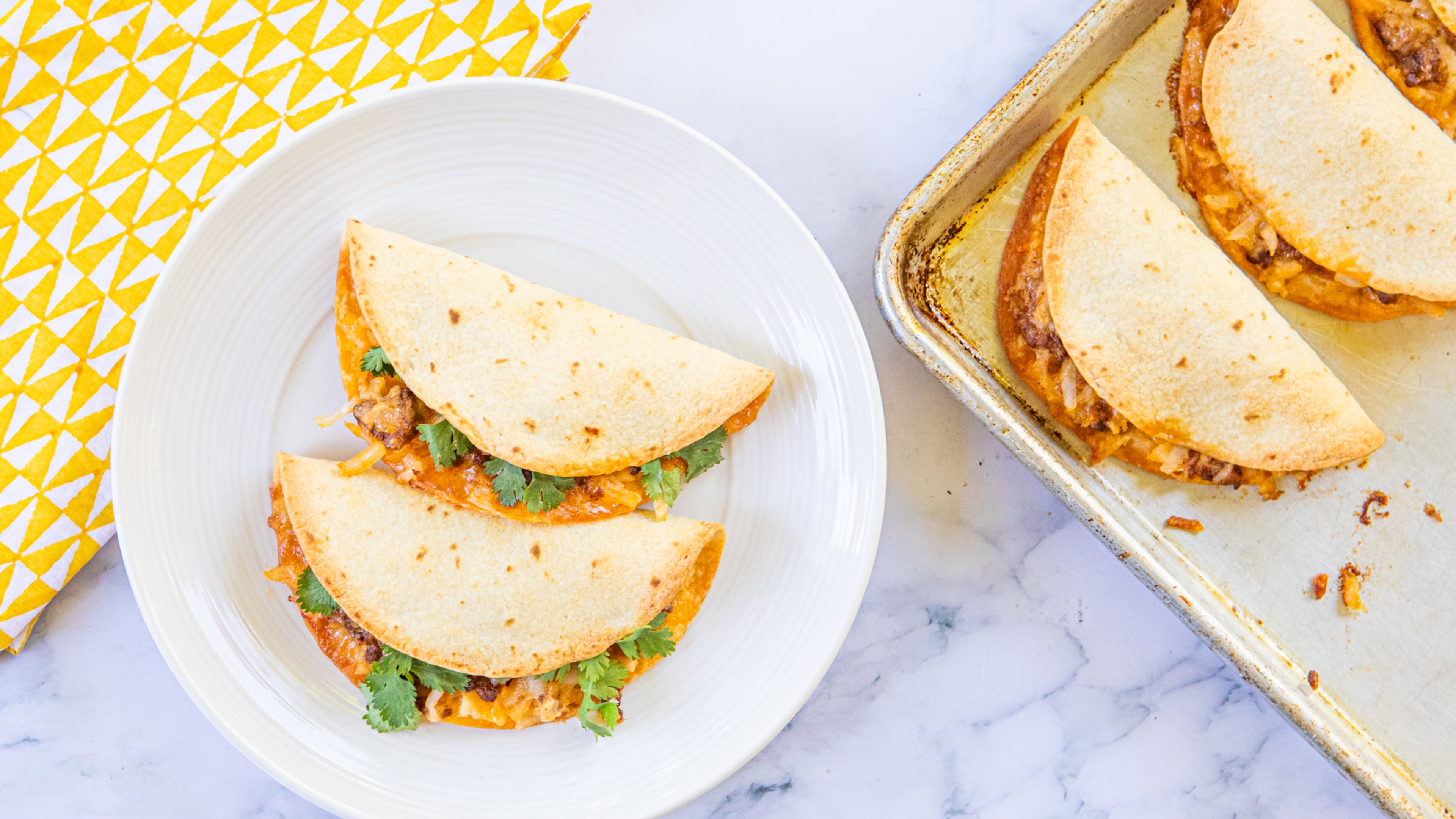 Fresh cilantro brings welcome brightness to the otherwise rich Crispy Chorizo-Potato Tacos. (Aaliyah Man for AJC/Food styling by Kate Williams)