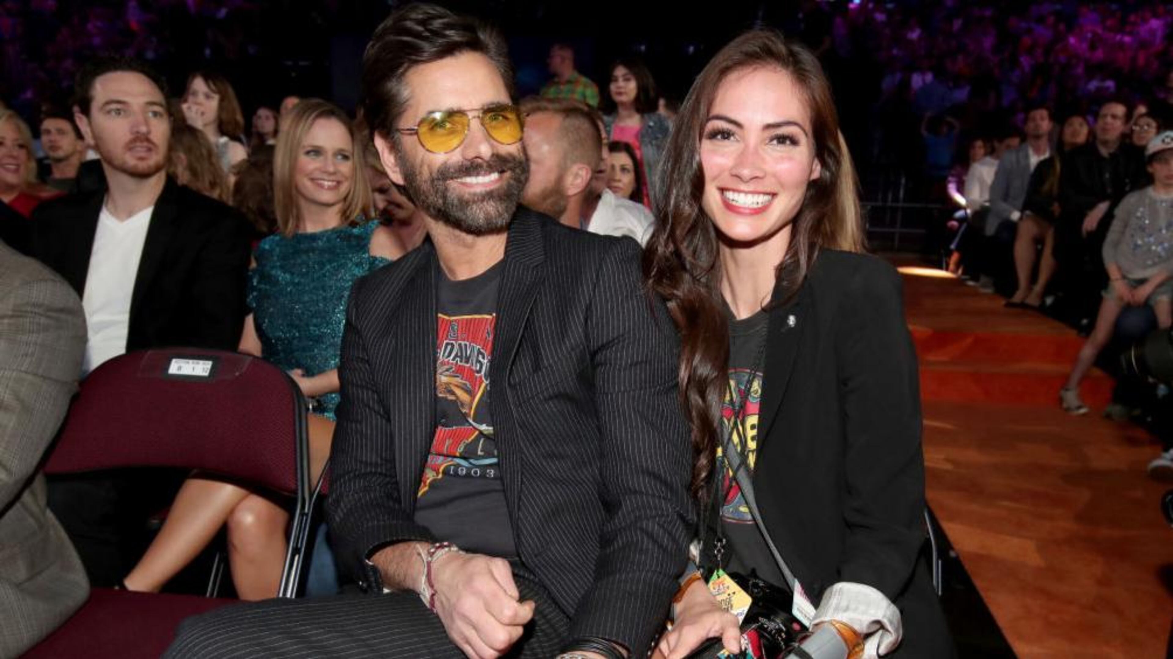 Actor John Stamos (L) and Caitlin McHugh at Nickelodeon's 2017 Kids' Choice Awards at USC Galen Center on March 11, 2017 in Los Angeles, California. (Photo by Chris Polk/KCA2017/Getty Images for Nickelodeon)