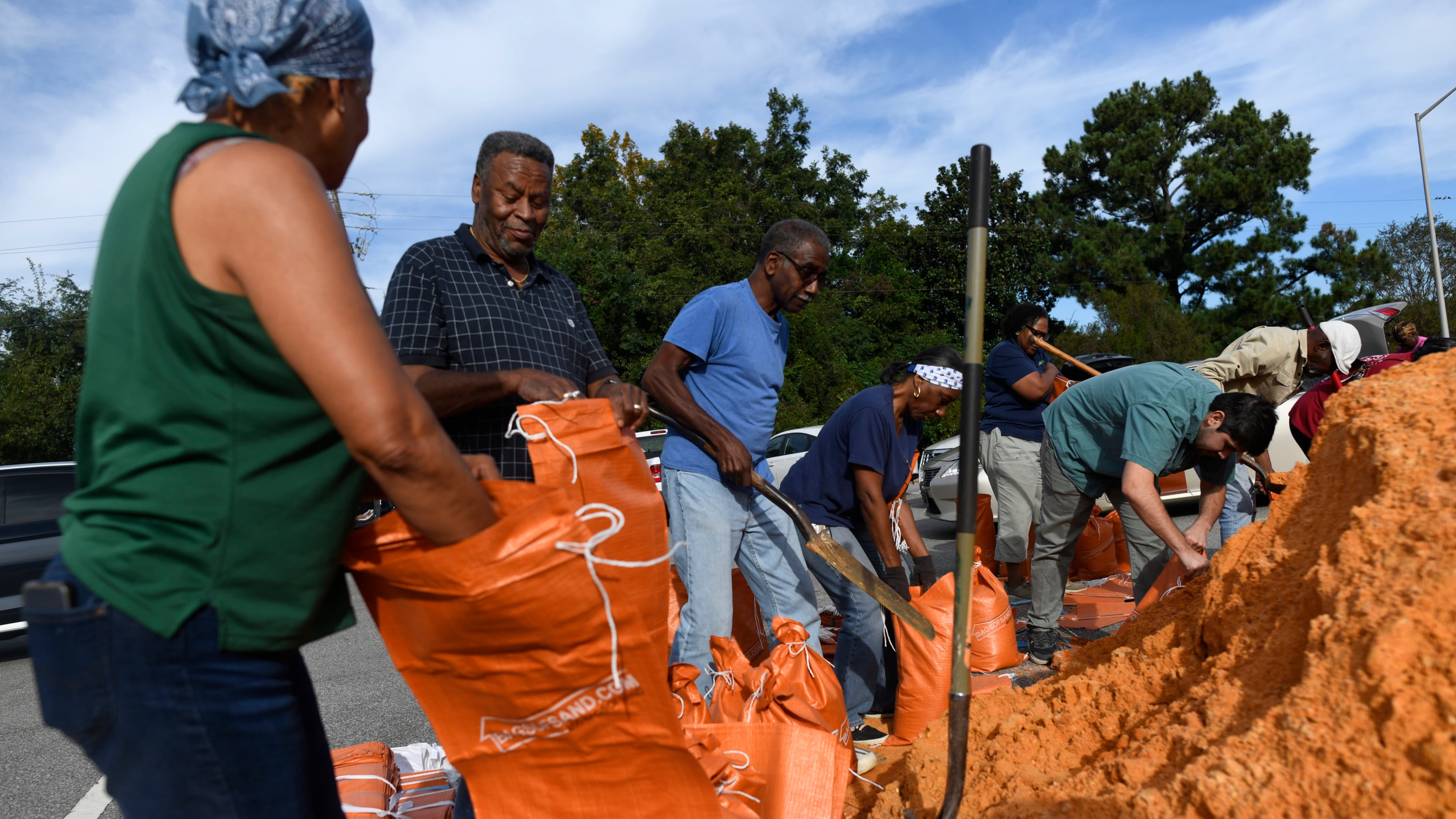 Residents pick up sandbags for storm preparation at the James Seals Jr. Parks & Recreation Center ahead of Hurricane Isaias' expected landfall along the Gulf Coast, Thursday, October 8, 2026, in Mobile, Alabama (AP Photo/Octavio Jones)