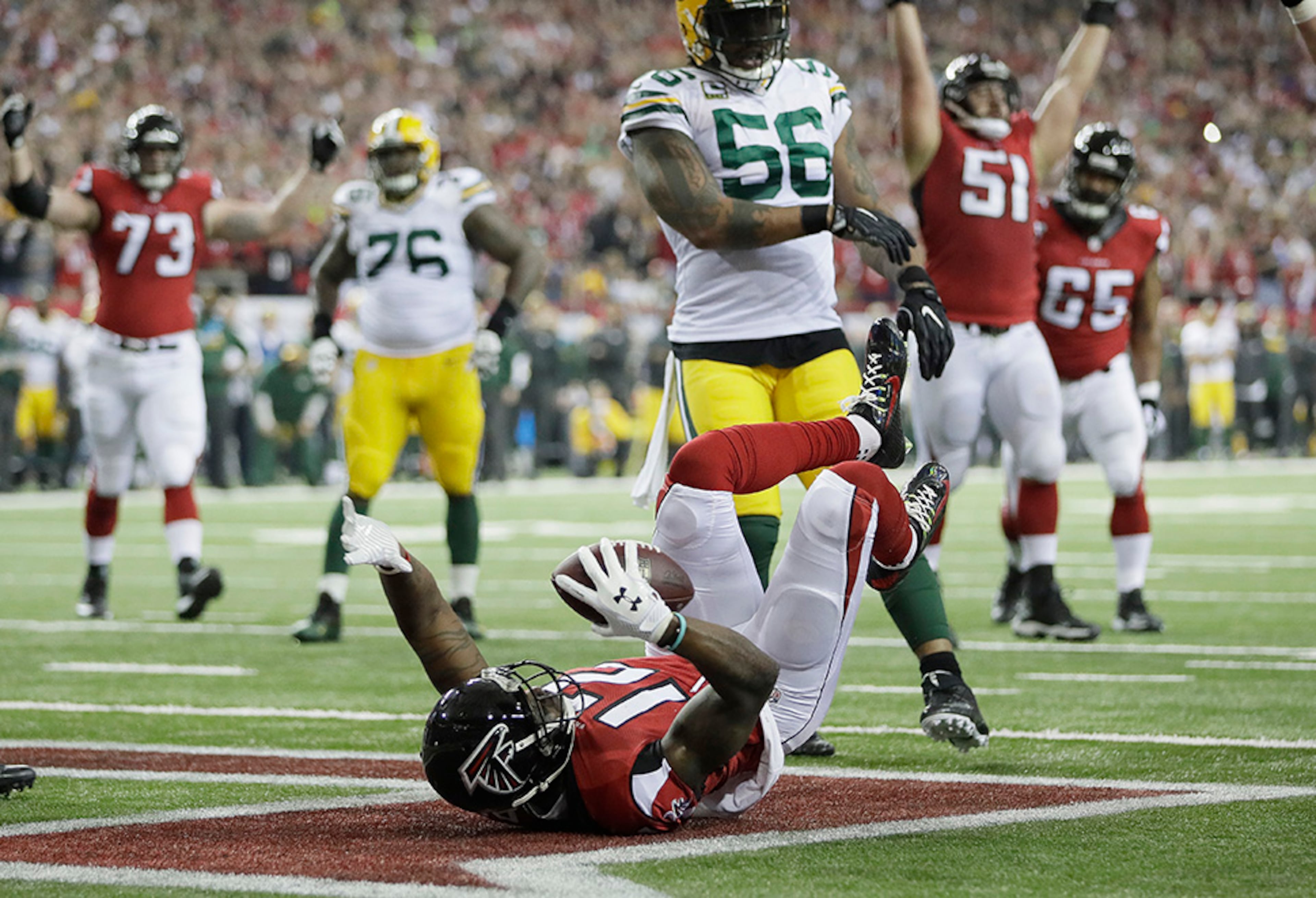 Atlanta Falcons' Mohamed Sanu reacts after catching a touchdown pass during the first half of the NFL football NFC championship game against the Green Bay Packers, Sunday, Jan. 22, 2017, in Atlanta. (AP Photo/Mark Humphrey)