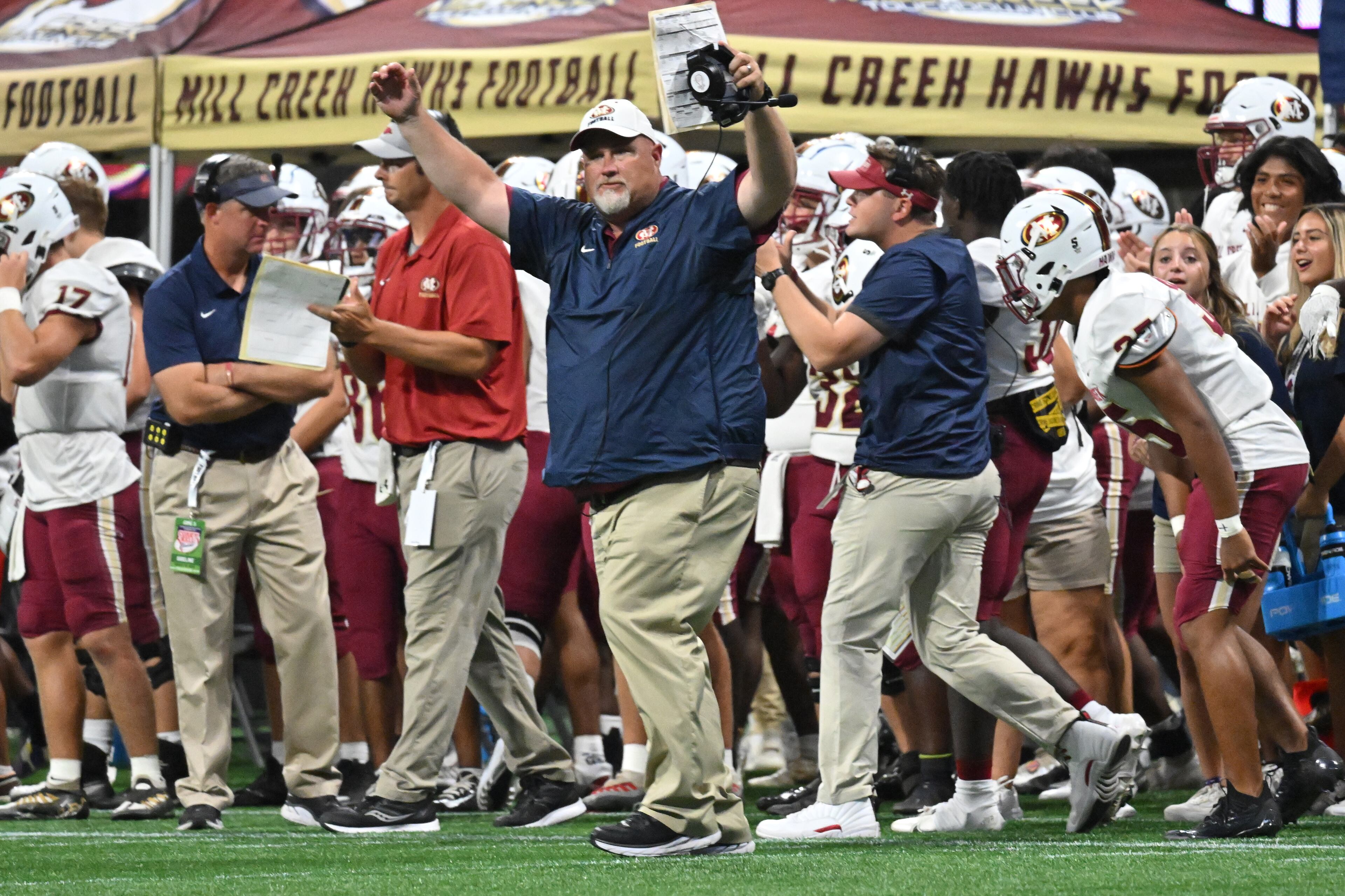 August 20 , 2022 Atlanta - Mill Creek's head coach Josh Lovelady reacts after the game winning touchdown by Mill Creek's Makhail Wood (4) during the 2022 Corky Kell Classic at Mercedes Benz Stadium on Saturday, August 20, 2022. Mill Creek won 44-41 over Walton. (Hyosub Shin / Hyosub.Shin@ajc.com)