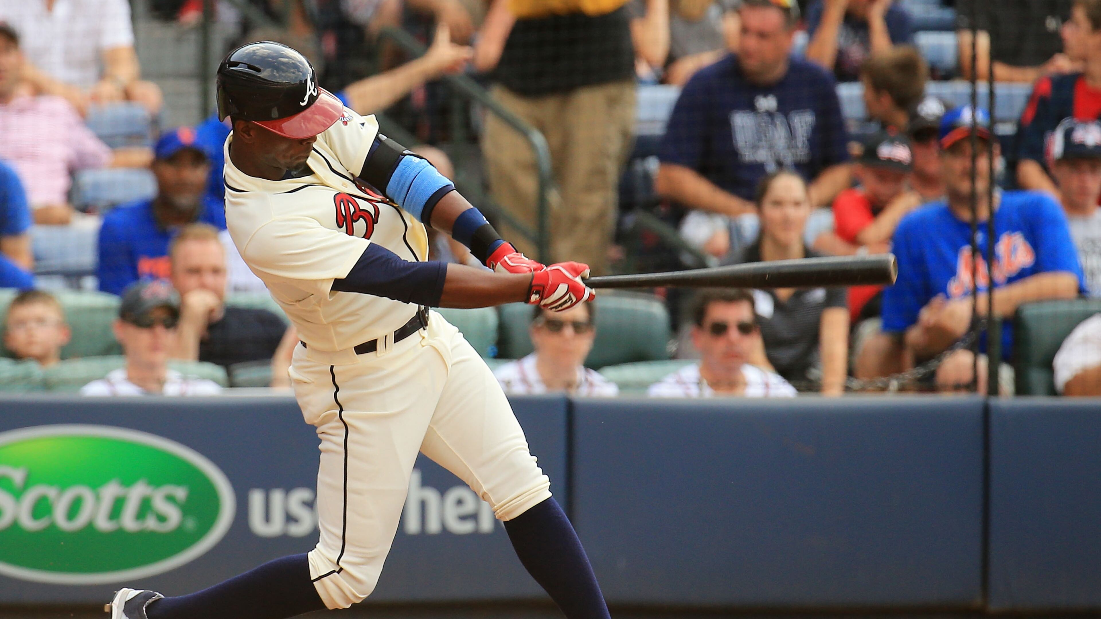 ATLANTA, GA - JUNE 21: Pedro Ciriaco #13 of the Atlanta Braves hits an RBI single during the seventh inning against the New York Mets at Turner Field on June 21, 2015 in Atlanta, Georgia. (Photo by Daniel Shirey/Getty Images)