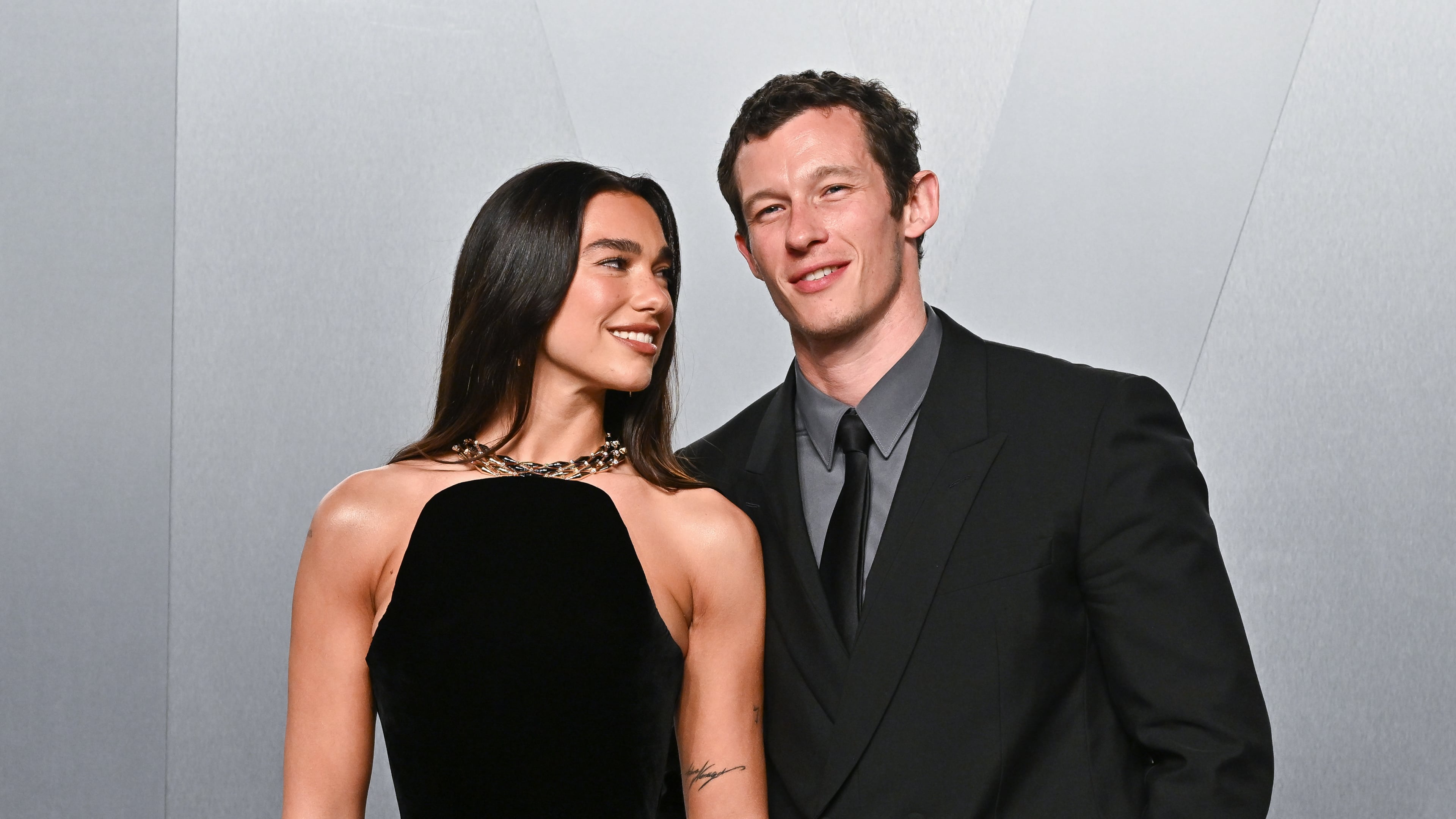 FILE - Dua Lipa, left, and Callum Turner arrive at the Vanity Fair Oscar Party on Sunday, March 15, 2026, at the Los Angeles County Museum of Art in Los Angeles. (Photo by Evan Agostini/Invision/AP, File)