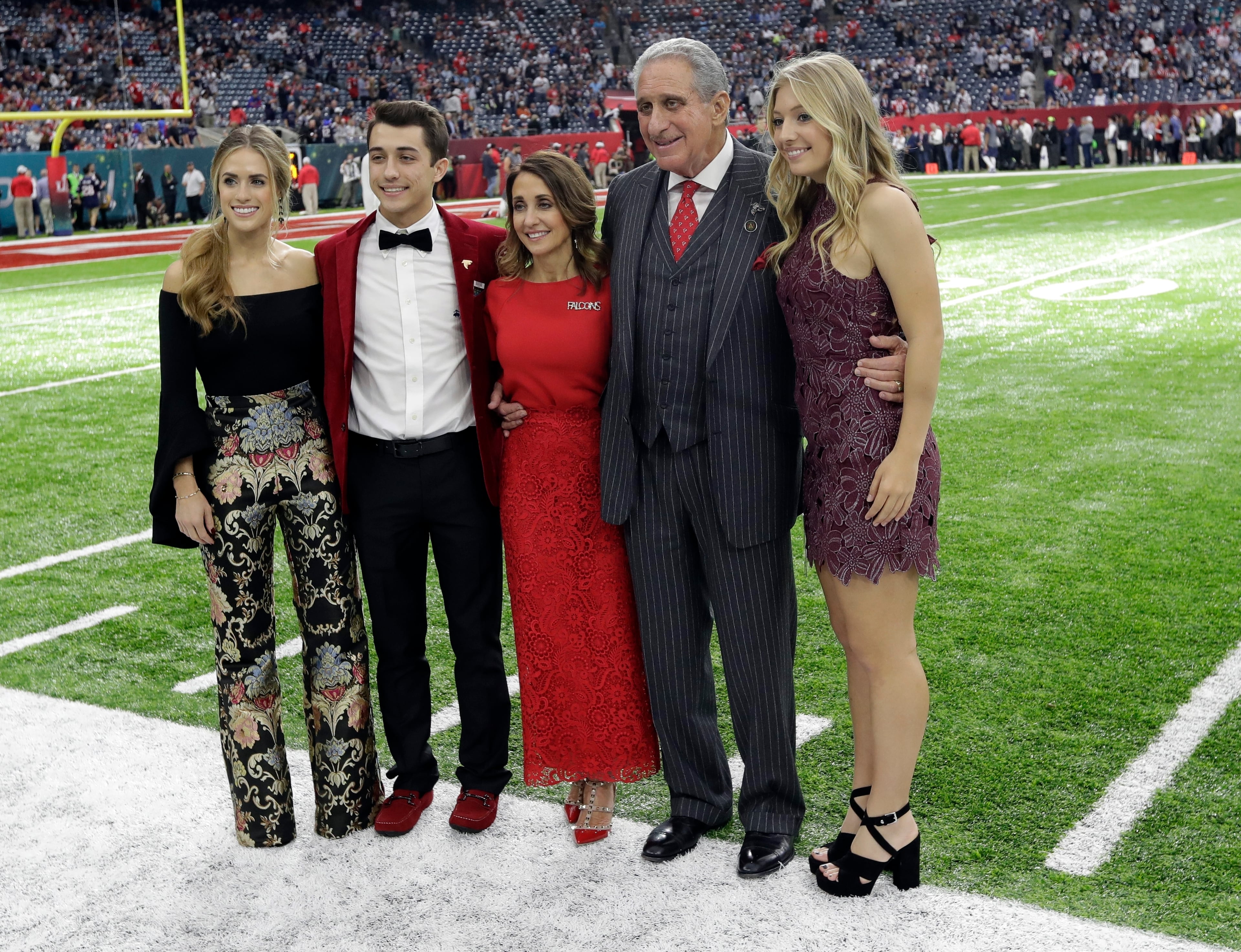 Atlanta Falcons owner Arthur Blank, second from right, poses with his family for a picture before the NFL Super Bowl 51 football game between the Atlanta Falcons and the New England Patriots Sunday, Feb. 5, 2017, in Houston. (AP Photo/David J. Phillip)